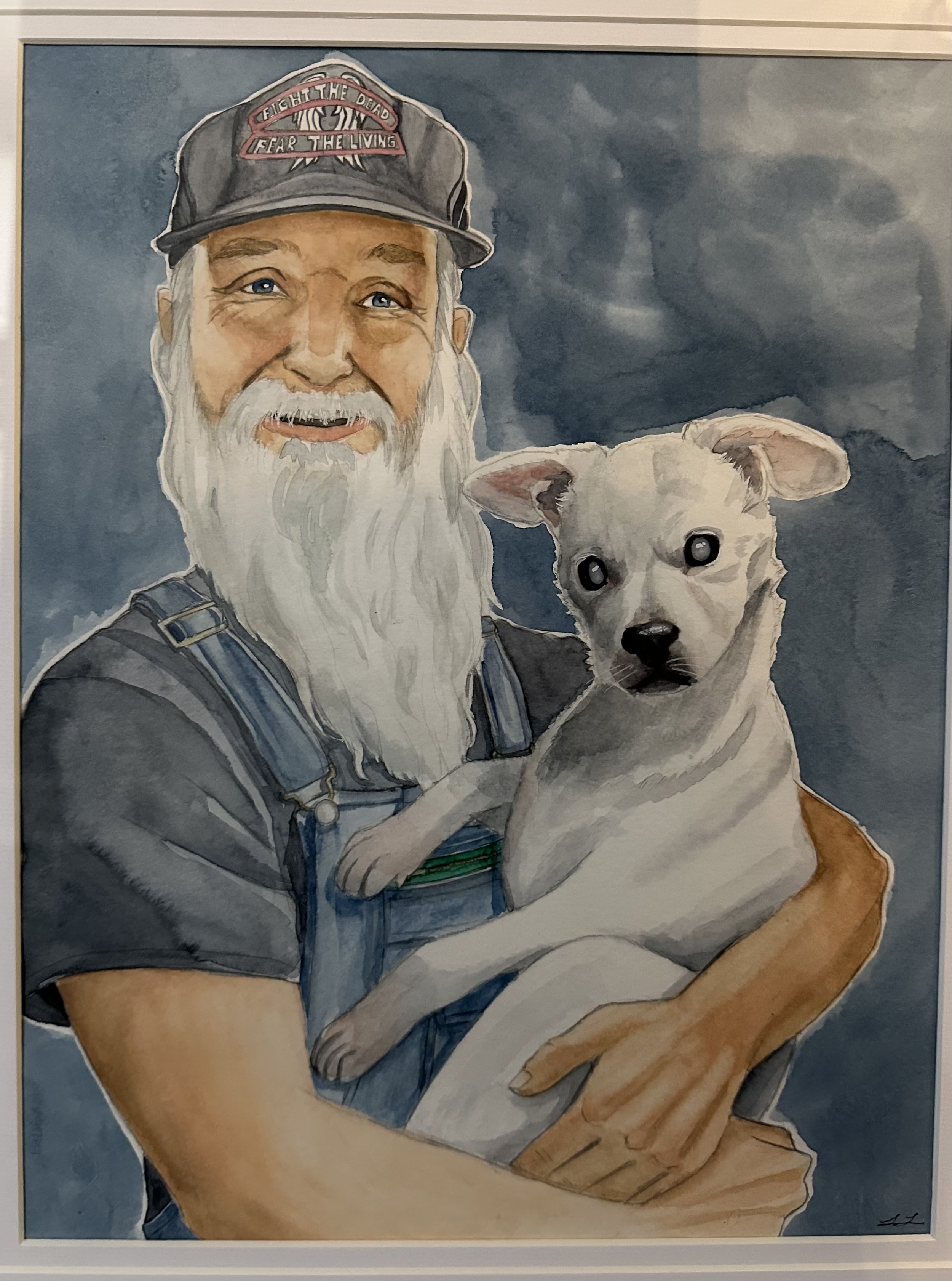 A watercolor painting of an elderly man with a long white beard, wearing a gray cap with a patch that reads 'Fight the Dead, Fear the Living,' and a gray shirt. He is smiling slightly and holding a small, light-colored dog with big, dark eyes, agains