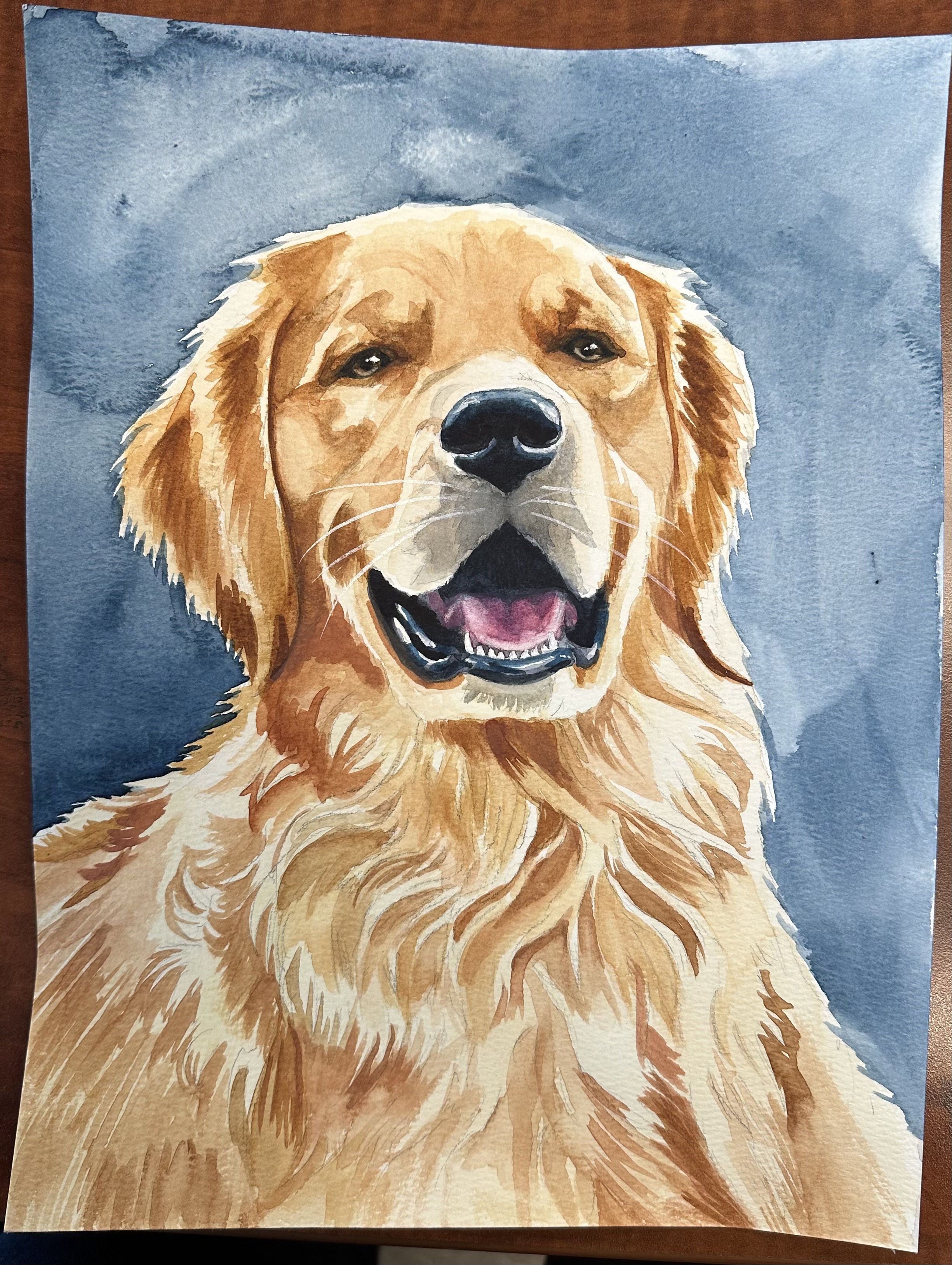 A watercolor painting of a Golden Retriever dog with a smiling expression, against a blue background.