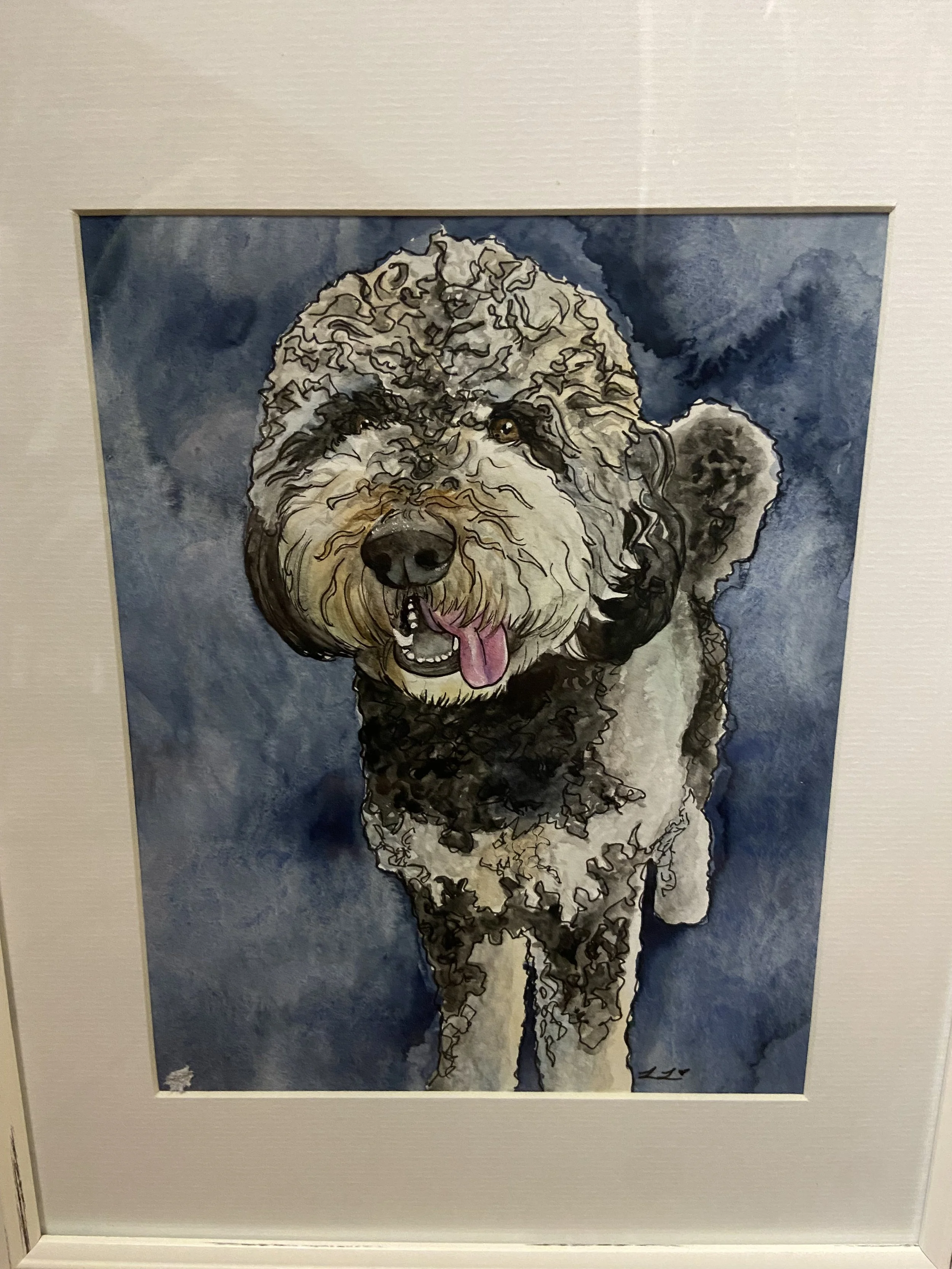 Watercolor painting of a happy, curly-haired dog with its tongue out, set against a dark blue background.