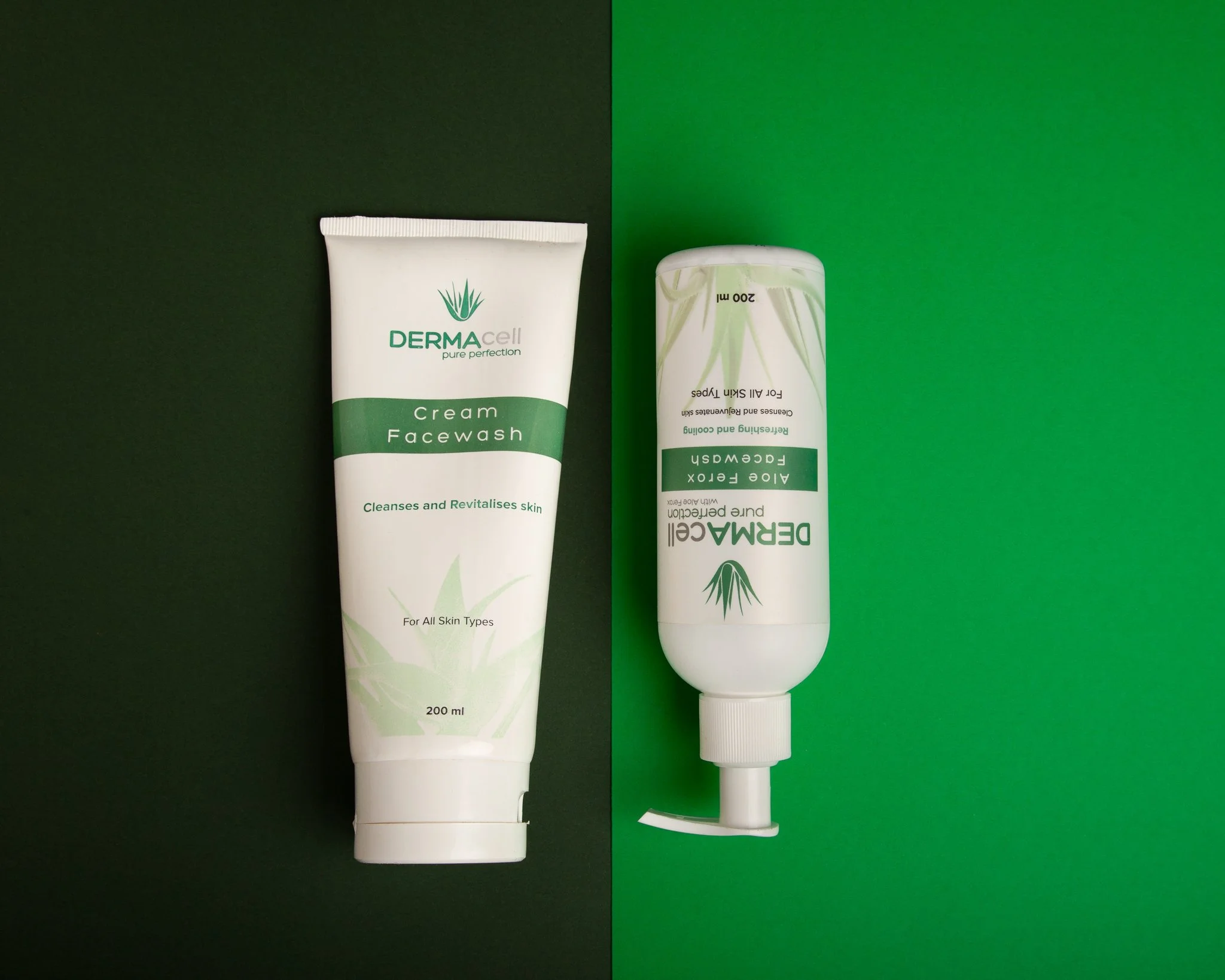Two bottles of Derma Cell facial cleansing products, one cream face wash and another with a pump dispenser, placed on a split background of green and black.