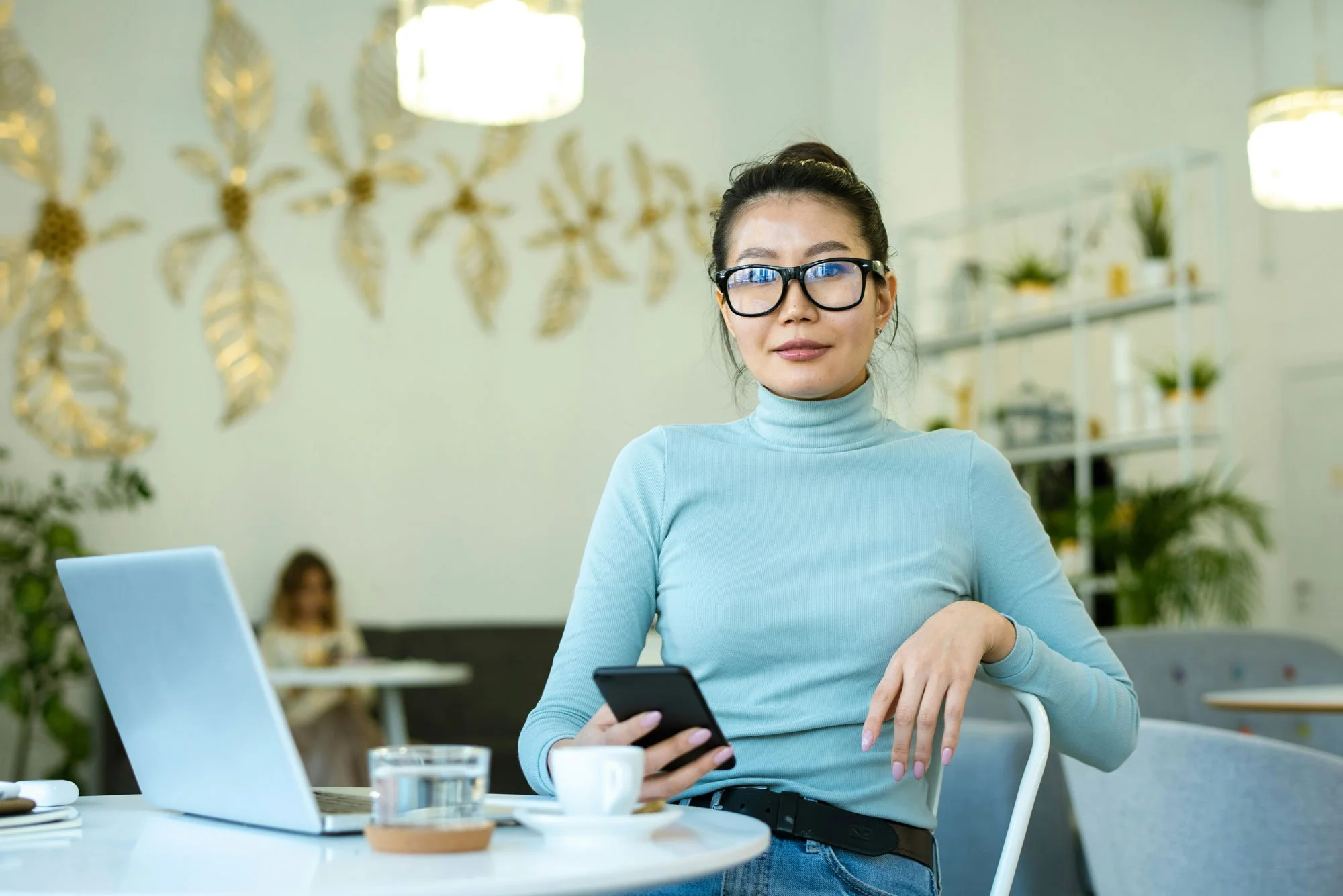 Original Lifestyle Photograph: Casual source image with bright overhead lights, background distractions, lens reflections, and uneven color before commercial retouching.