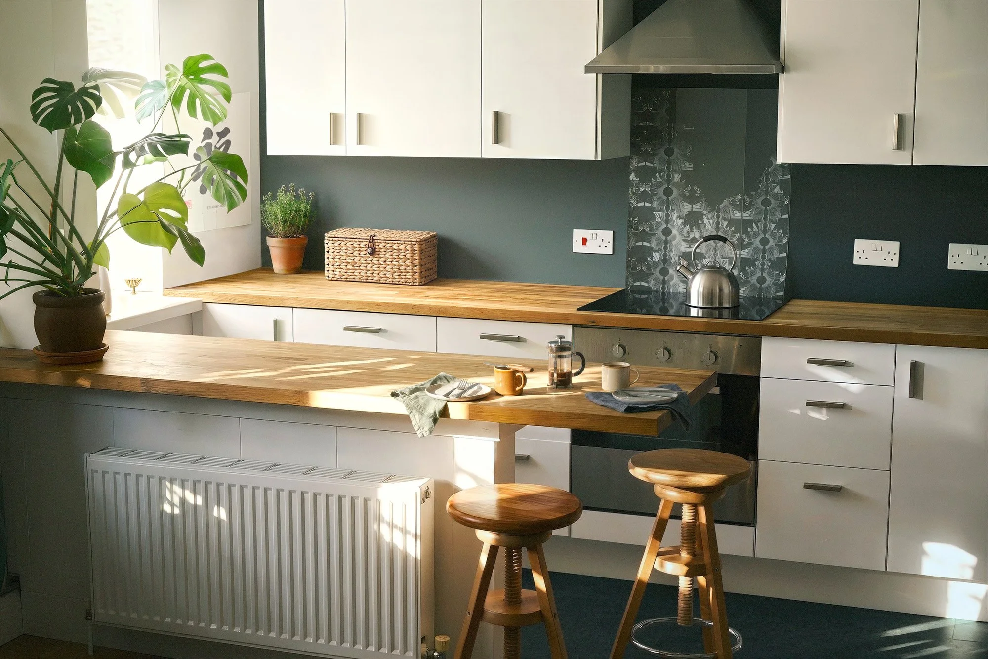 Final Decluttered Kitchen | Kitchen interior after extensive object removal, surface reconstruction, lighting correction, and final real estate image finishing.