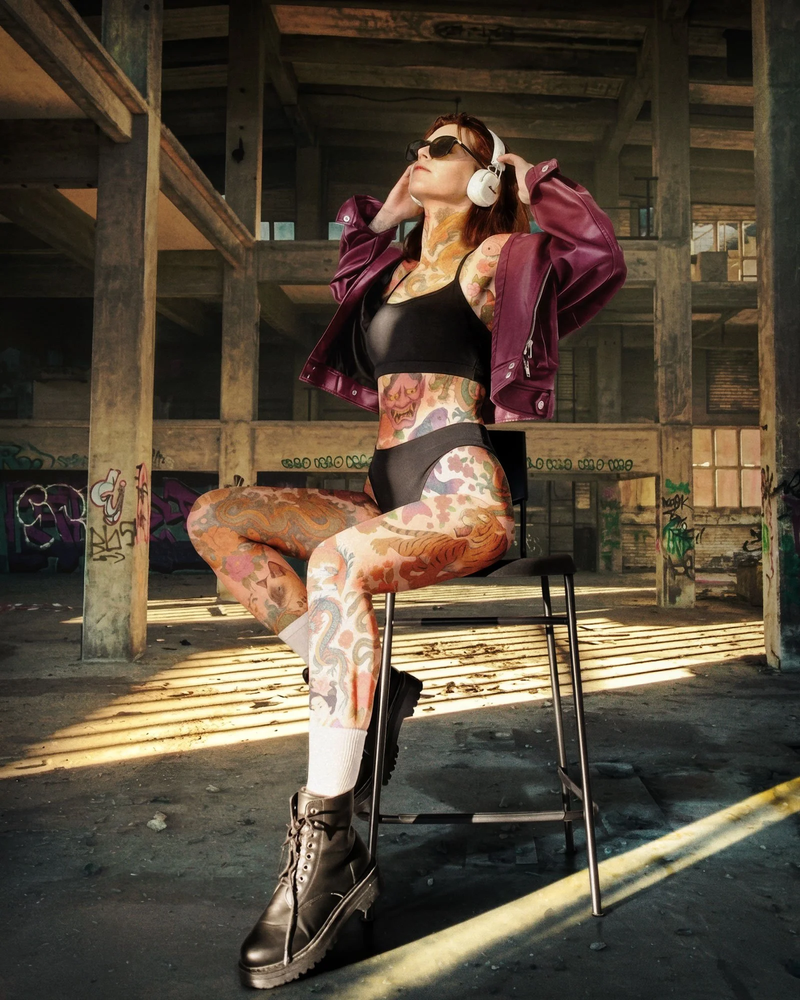 Final Editorial Portrait | Studio subject transformed through warehouse environment replacement, digital tattoo integration, relighting, color correction, and final Photoshop finishing.