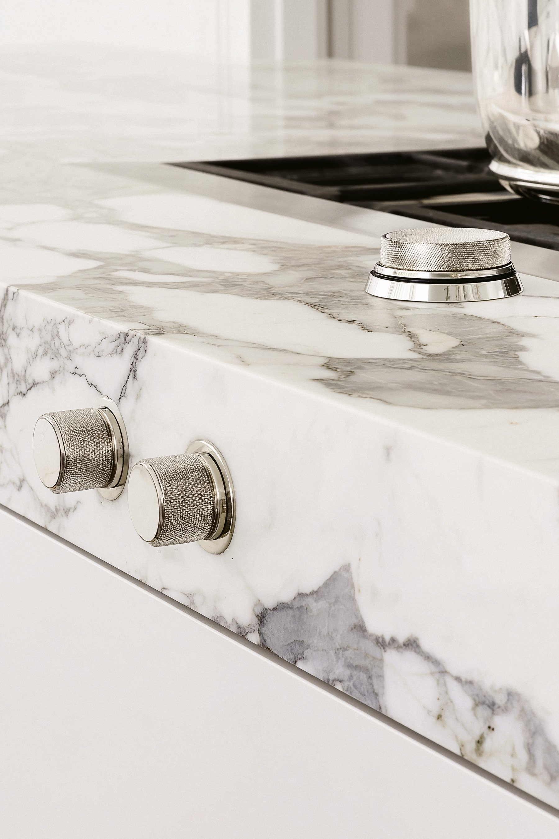 studio-sakaia-calacatta-marble-kitchen-countertop-with-brushed-nickel-knobs.jpg