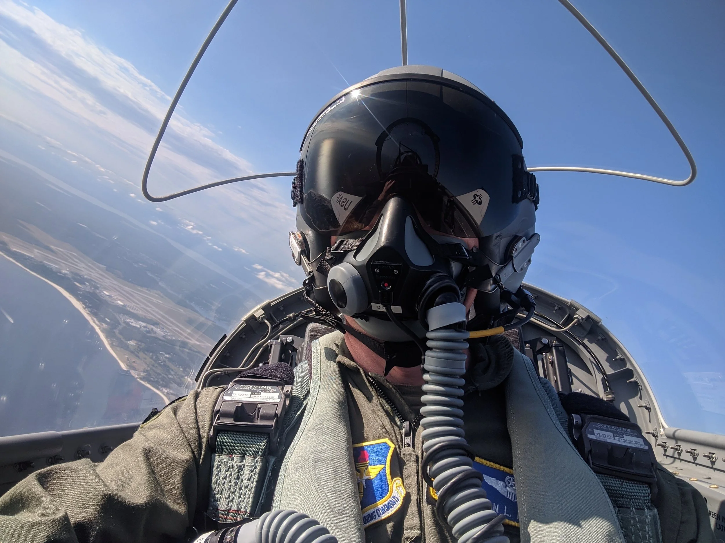 Colonel Brian L. Reece flying a T-6 Texan II over the coast of Florida