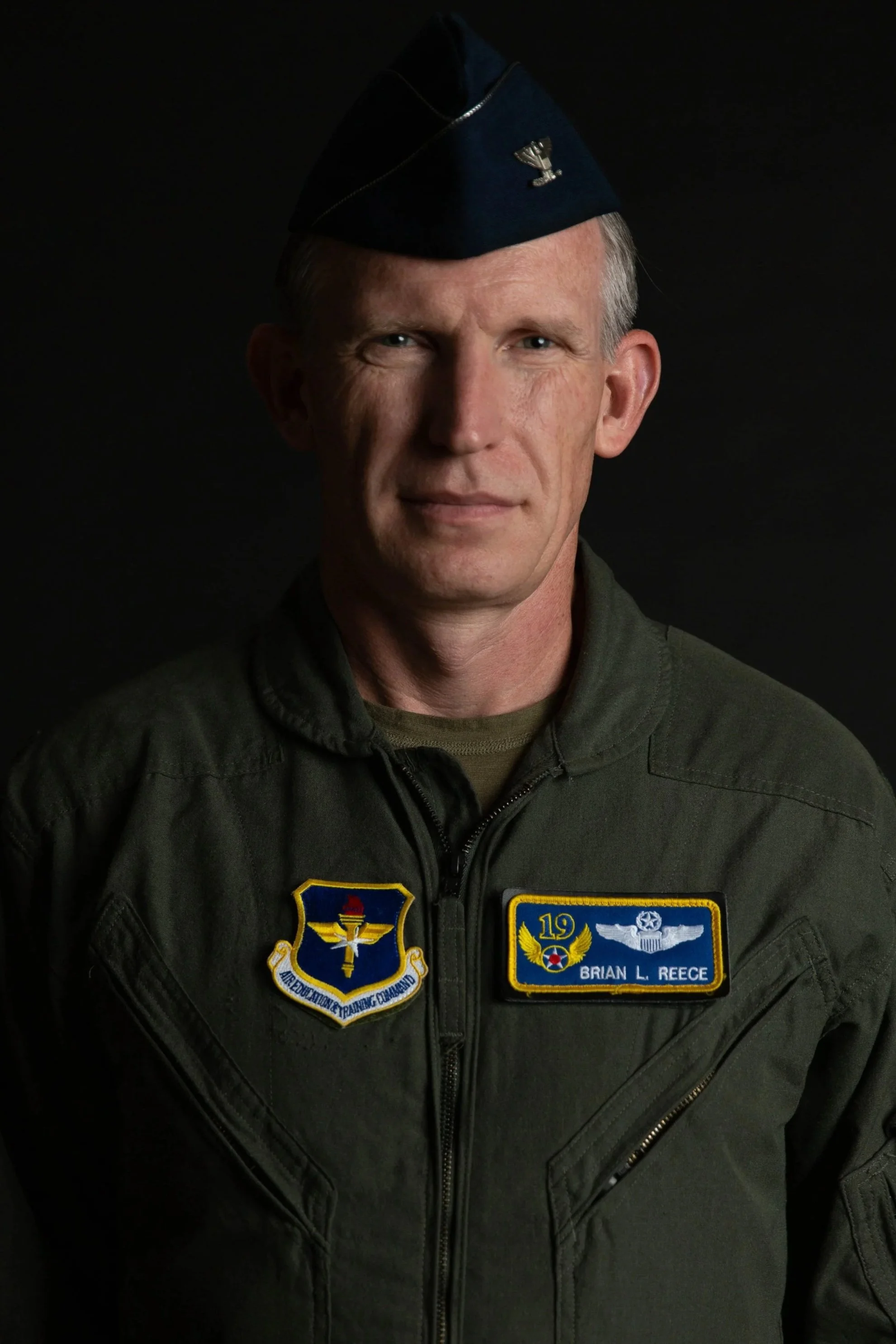 Portrait of Col Brian L. Reece in his flightsuit.