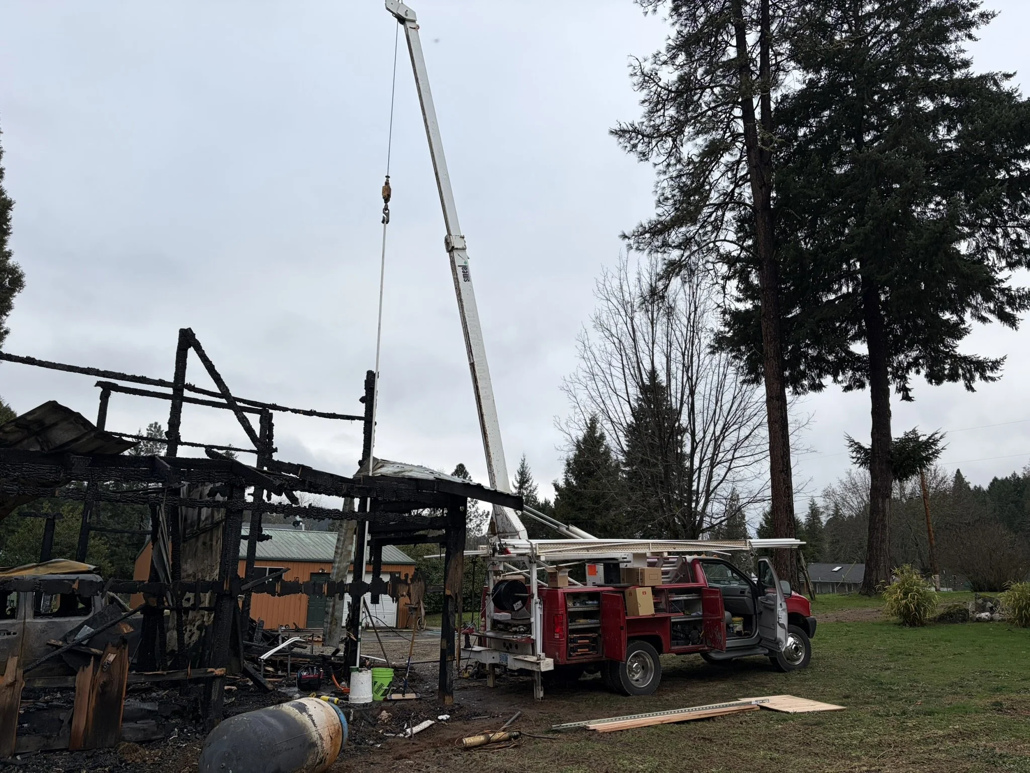 Well pump house burned down and re setting the well with a red pump truck