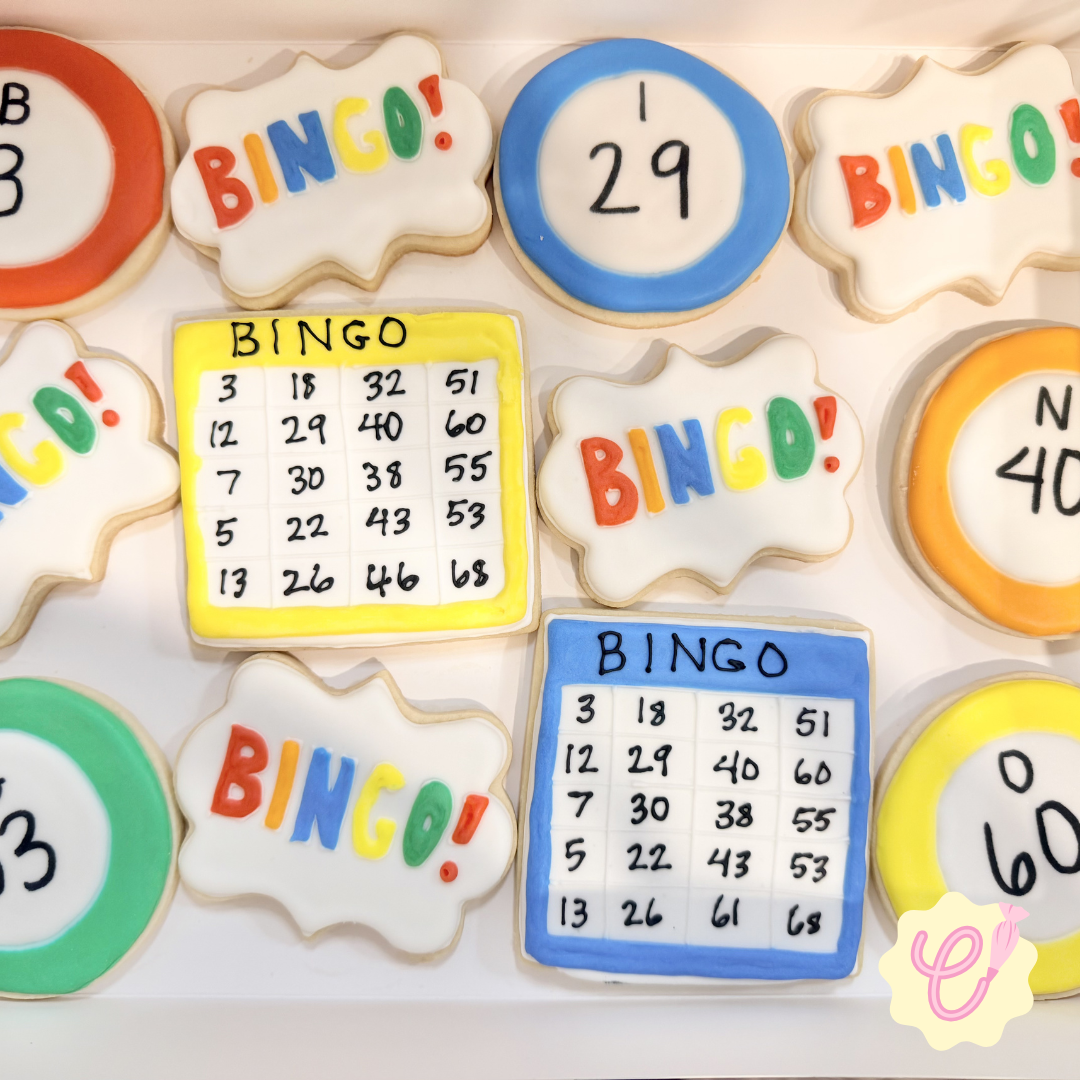 Decorative cookies themed around Bingo, featuring words like 'BINGO!' and images of Bingo cards, with colorful icing and playful shapes.