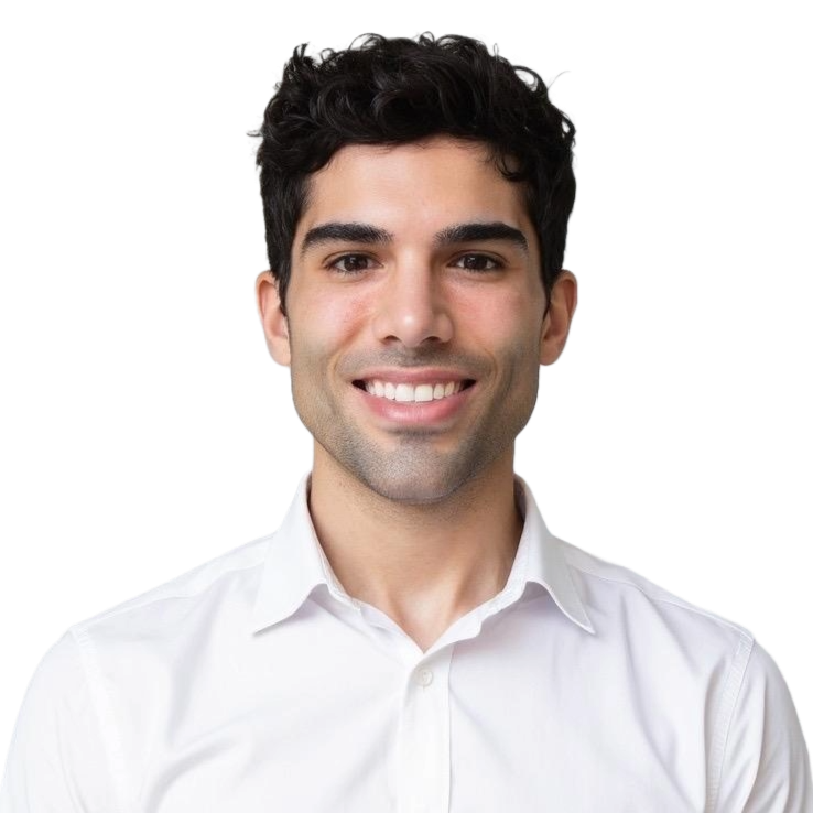 A young man with dark hair, wearing glasses, a white shirt, a patterned tie, and a black suit jacket, smiling against a black background.