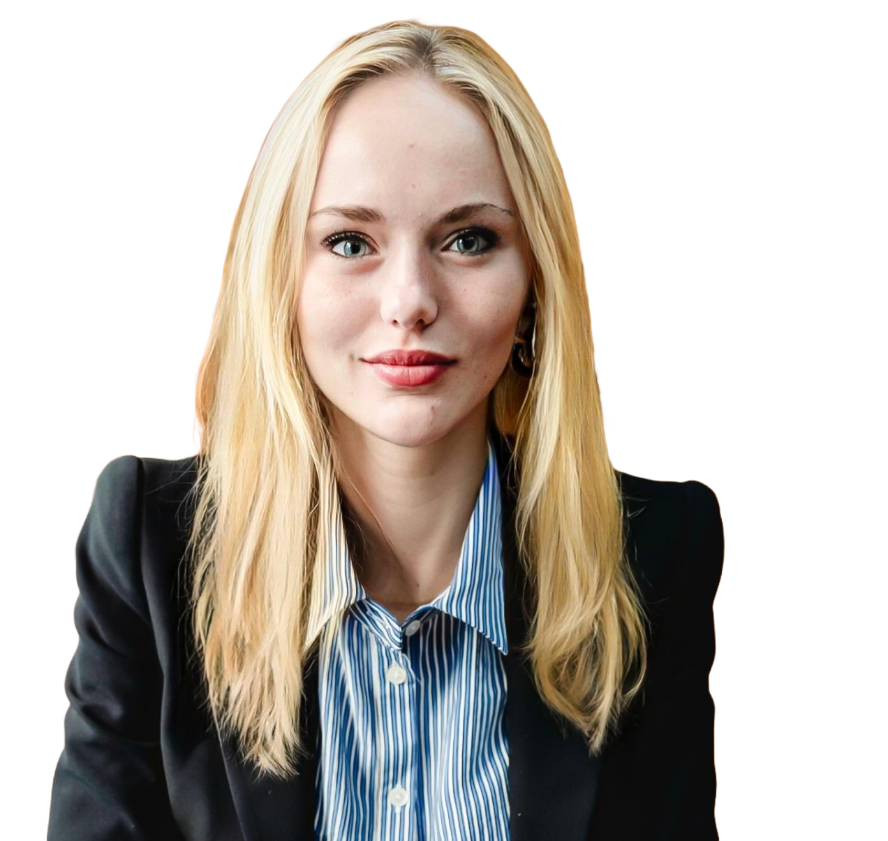 A young woman with long blonde hair, blue eyes, and fair skin, wearing a black blazer and a blue and white striped collared shirt, looking at the camera with a slight smile.