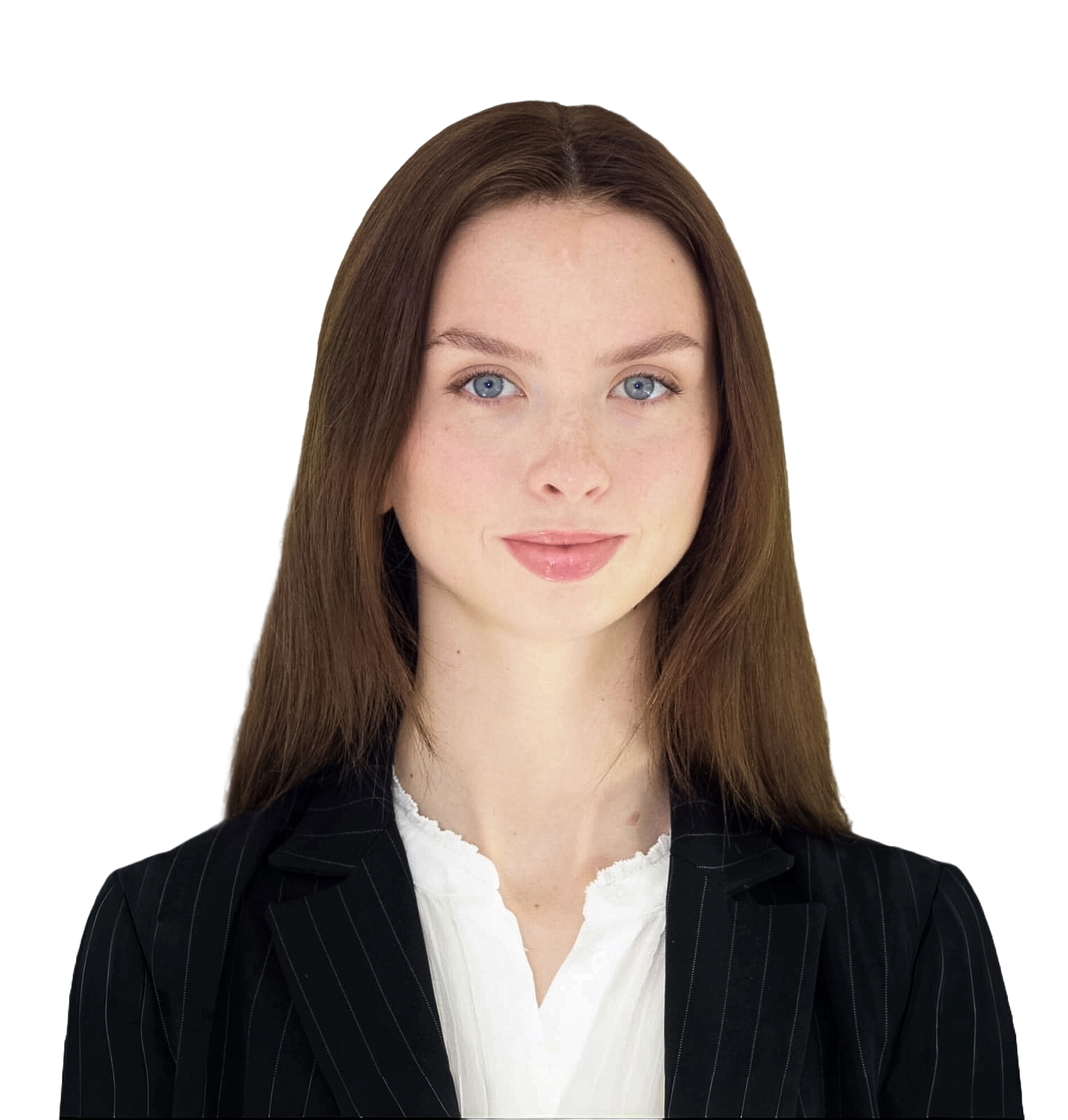Portrait of a young woman with long red hair, blue eyes, wearing a black pinstripe blazer and white blouse, against a black background.