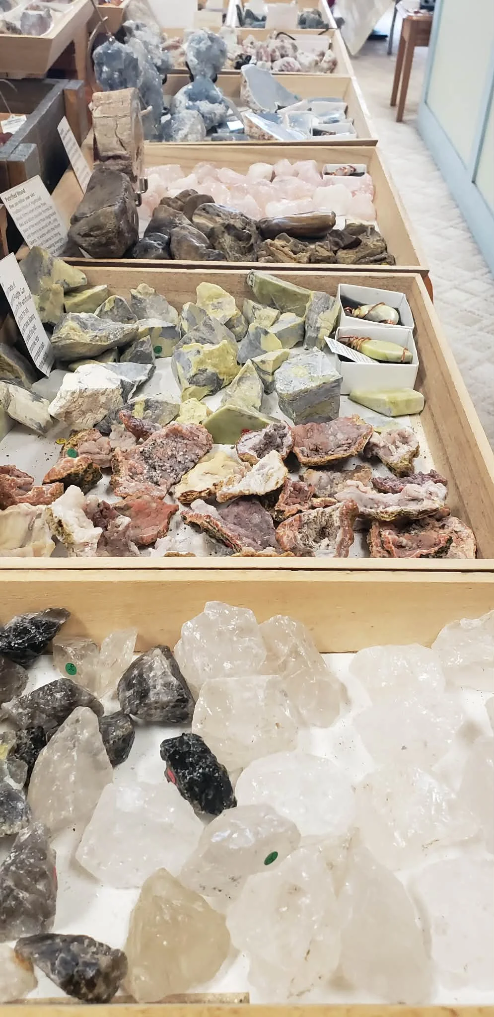 an enormous selection of rough raw crystals minerals geodes tibetan singing bowls jewelry black tourmaline kyanite sodalite green aventurine celestite rhodonite moss tree agate citrine dolomite obsidian mahogany lapis lazuli pegmatite chalcopyrite