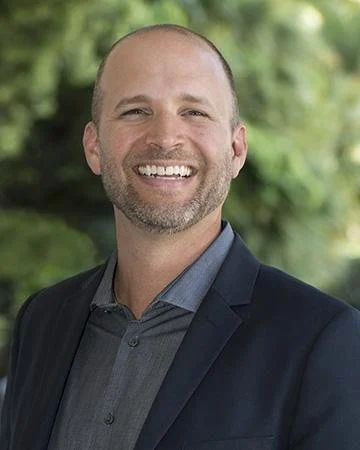 Photo of Tyson Eckerle in suit