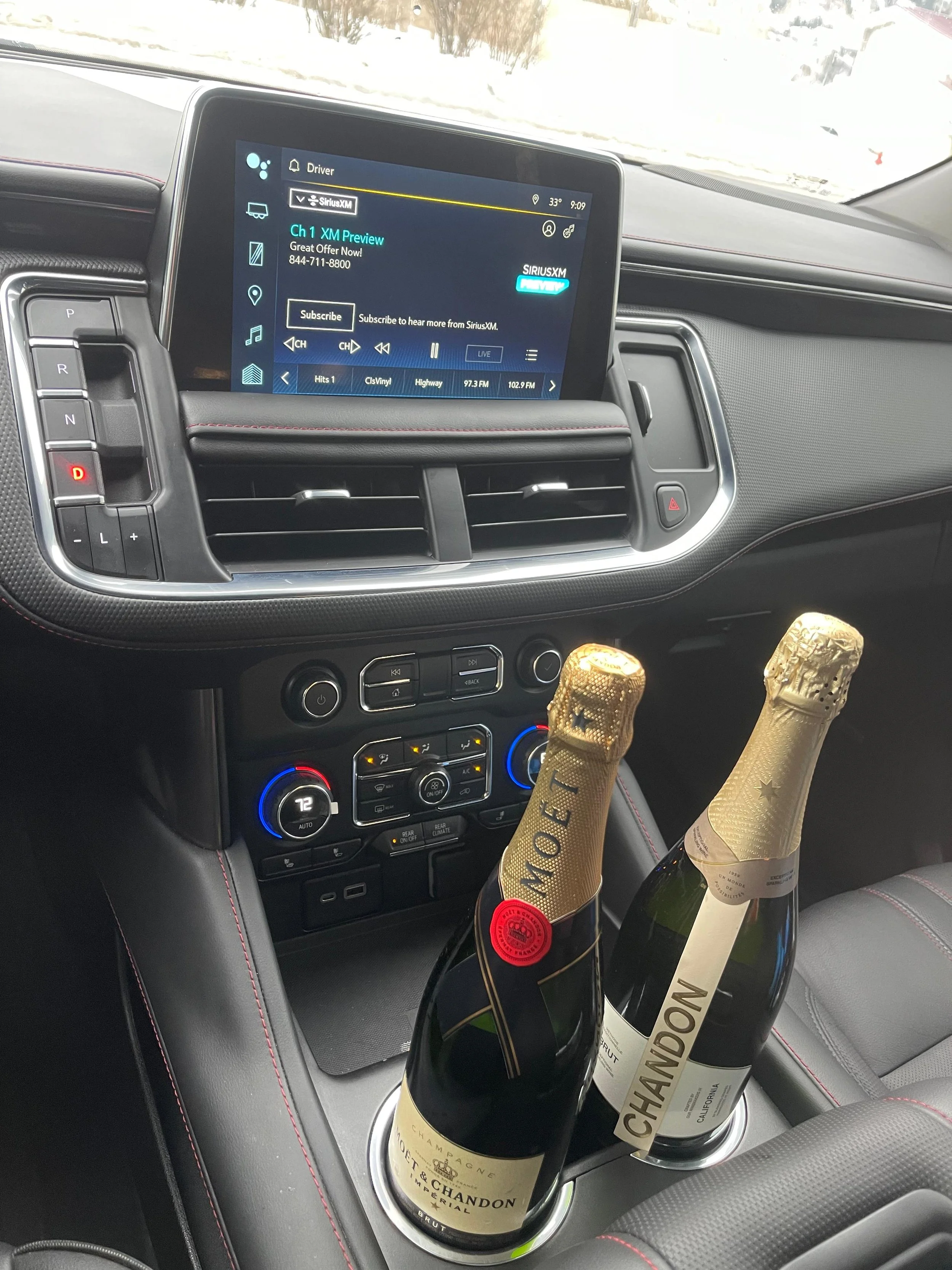 Champagne bottles inside an IZKAM luxury SUV for a special event