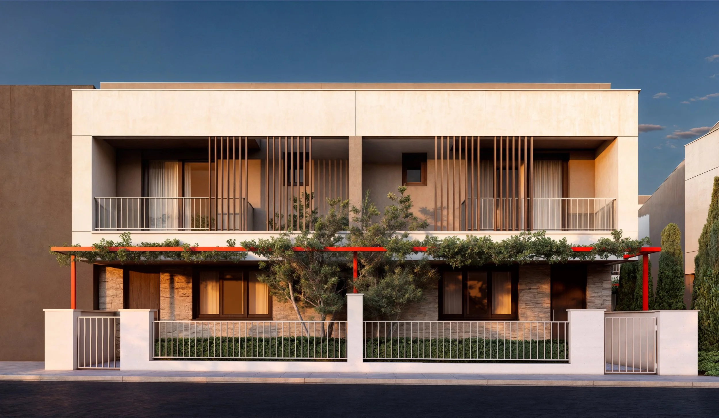 Modern two-story house with a landscaped front yard, white fence, and wooden accents, under a clear evening sky.