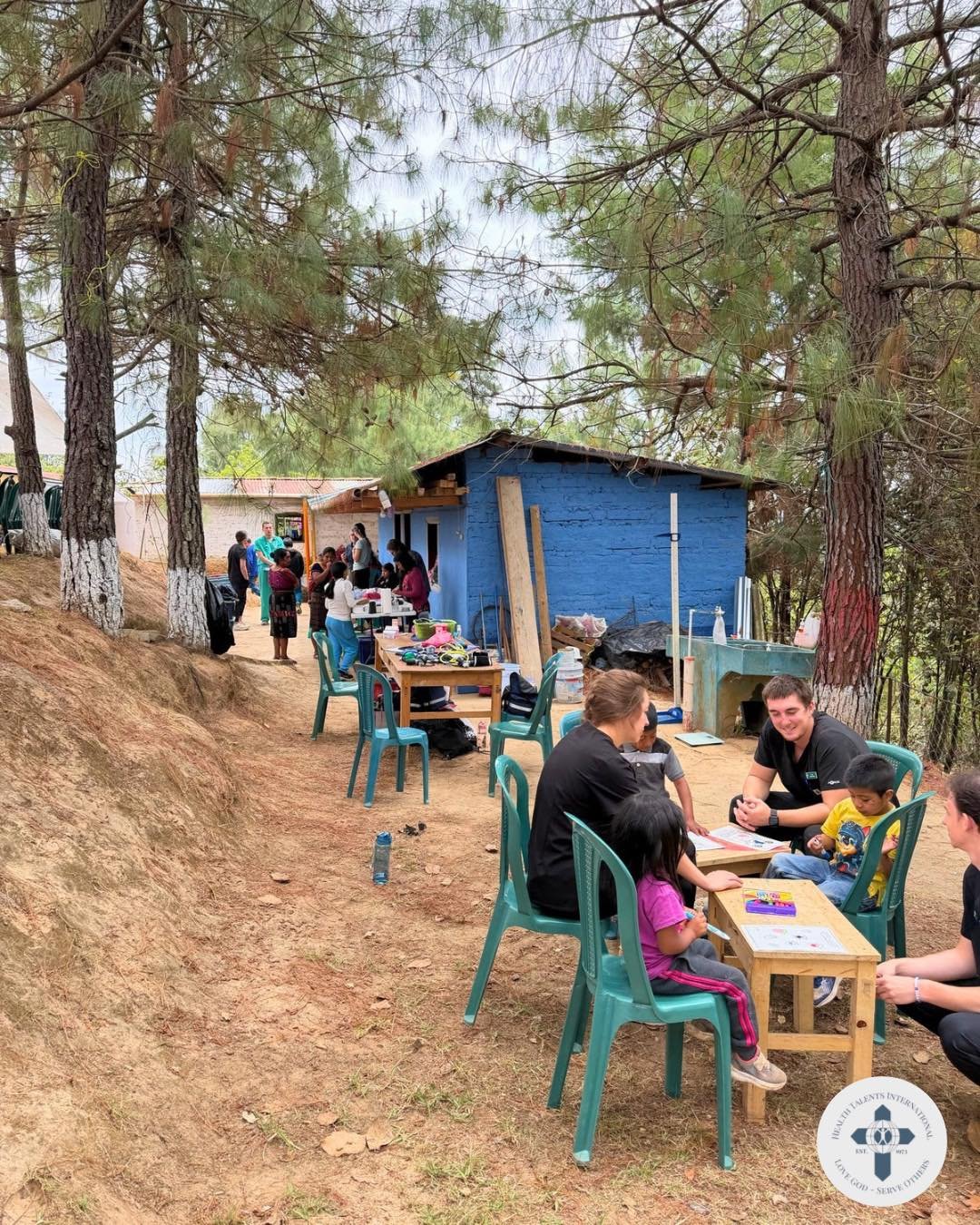 This photo feels like a real snapshot of mission life. 💛

There&rsquo;s no perfect pose or polished setup&mdash;just people fully present in the moment. Volunteers coloring with children, conversations happening in the background, patients waiting, 