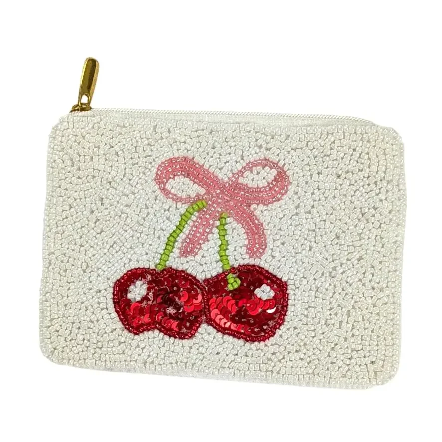 Beaded clutch bag with cherry and bow design made of sequins and beads.