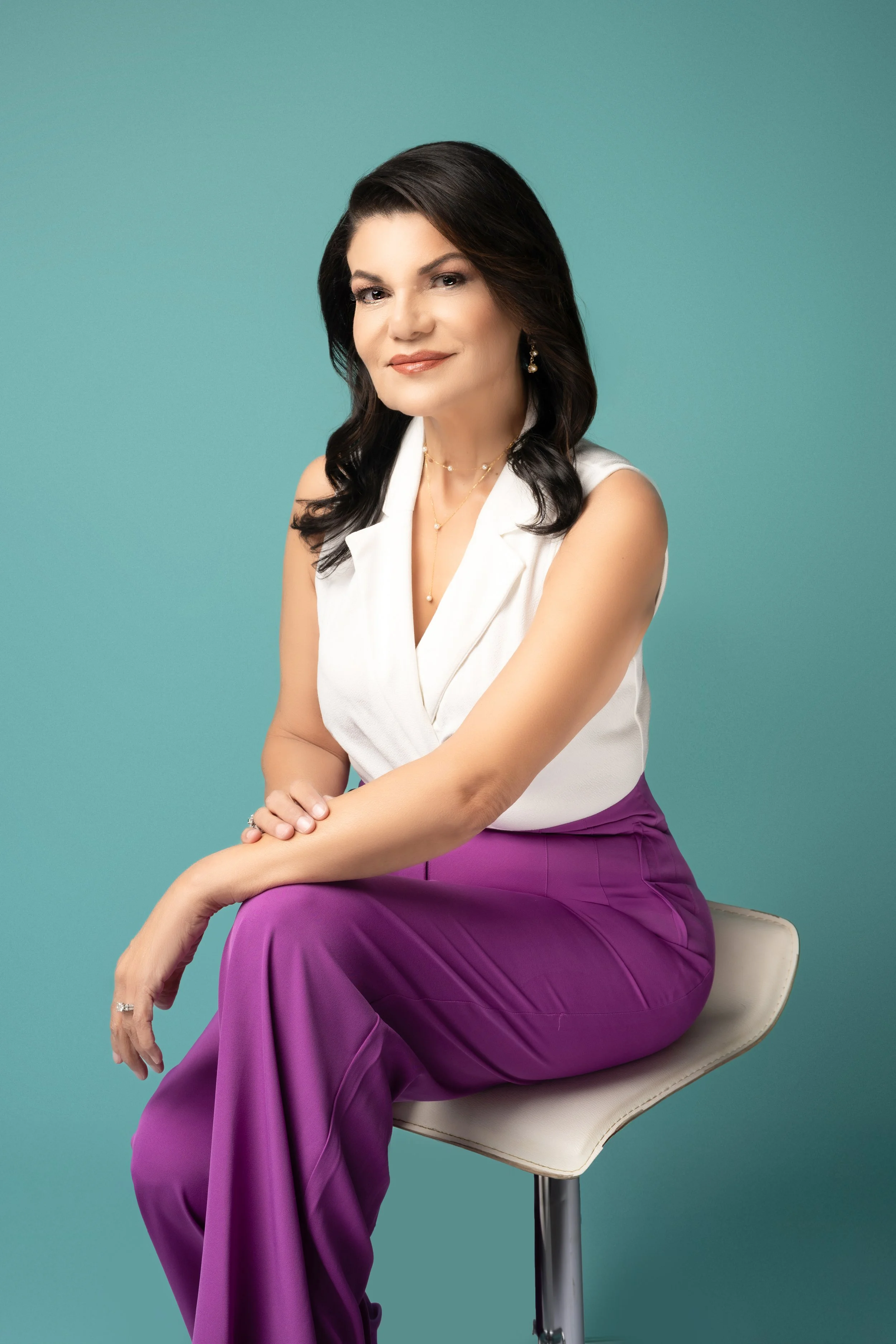 Businesswoman positioned as a recognized expert in a studio branding portrait.