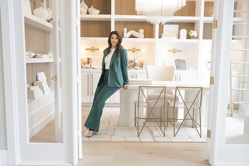 Professional branding portrait of a businesswoman photographed in her office.