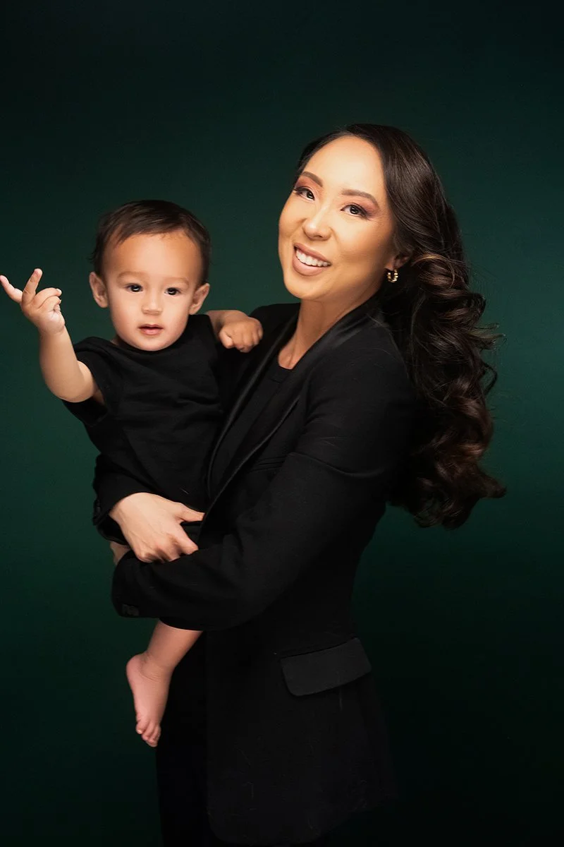 Female entrepreneur Lisa Sutton Gunderson with her son posing for the cover of She Means Business Magazine in Las Vegas.