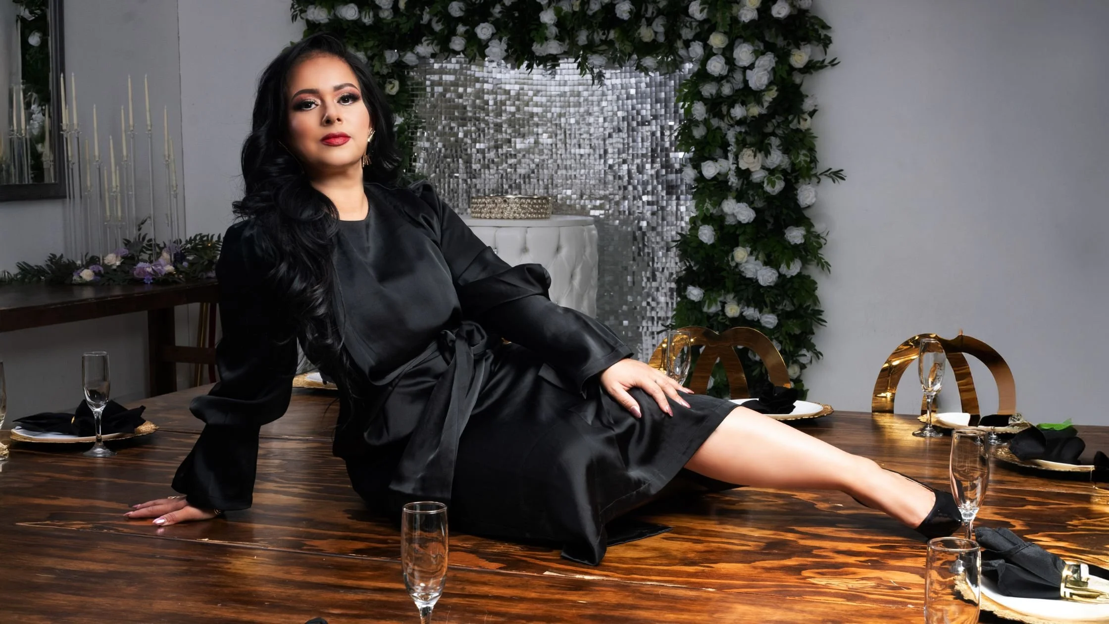 Woman entrepreneur during a content-focused branding session in a Las Vegas studio with dramatic lighting.