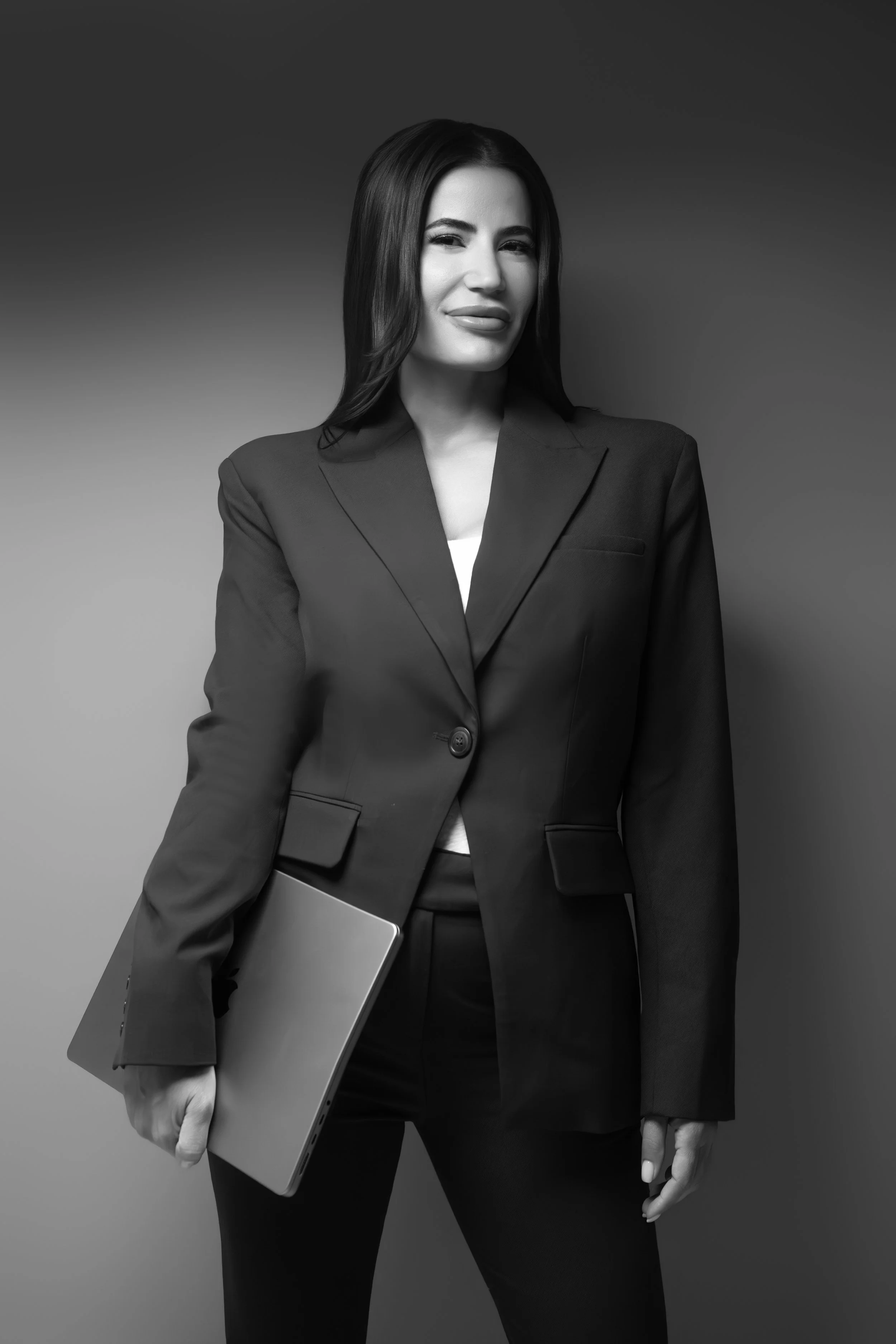 Businesswoman photographed in studio for a personal branding and networking feature.