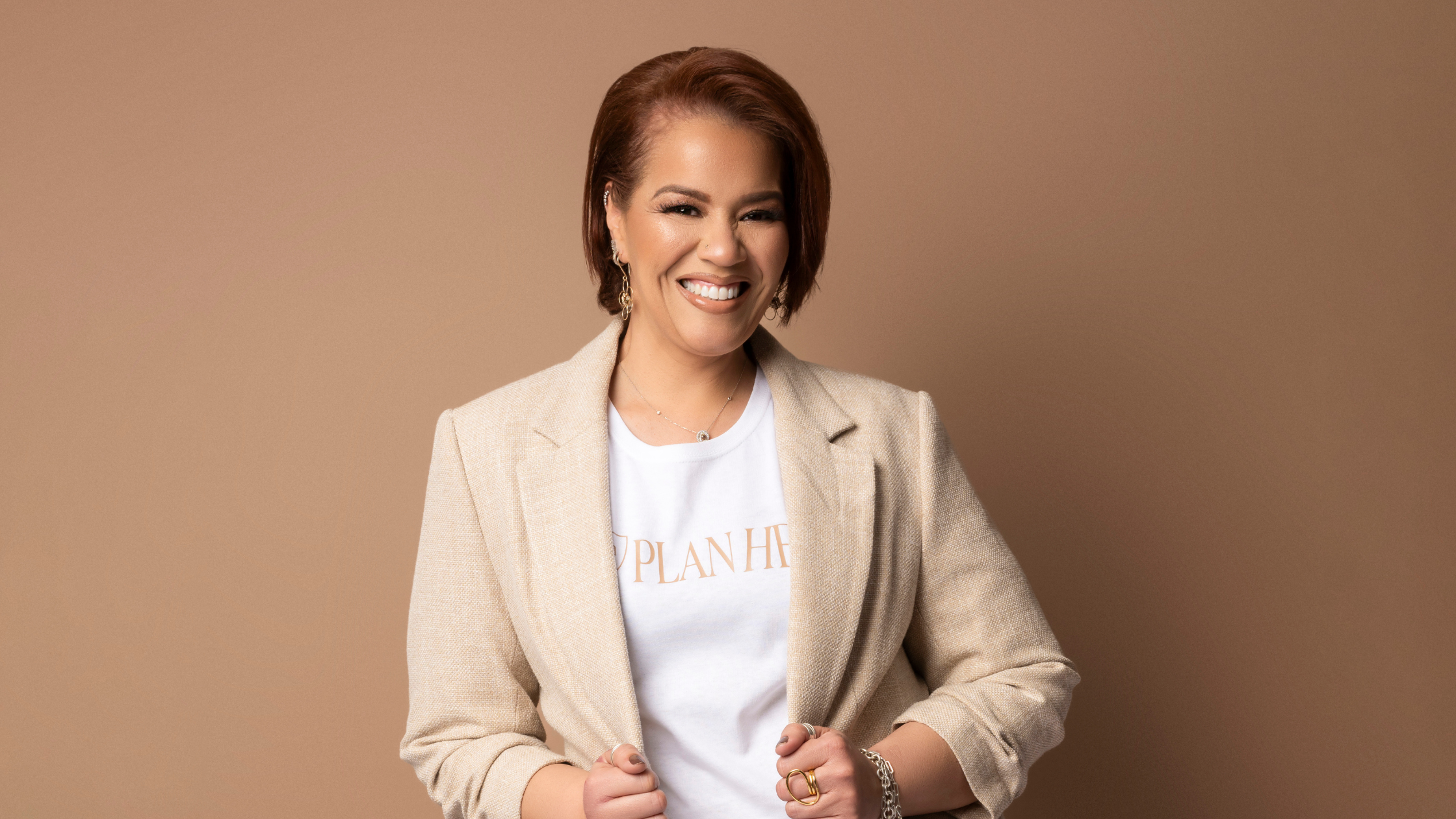 Businesswoman positioned as an industry expert in a professional studio branding portrait.