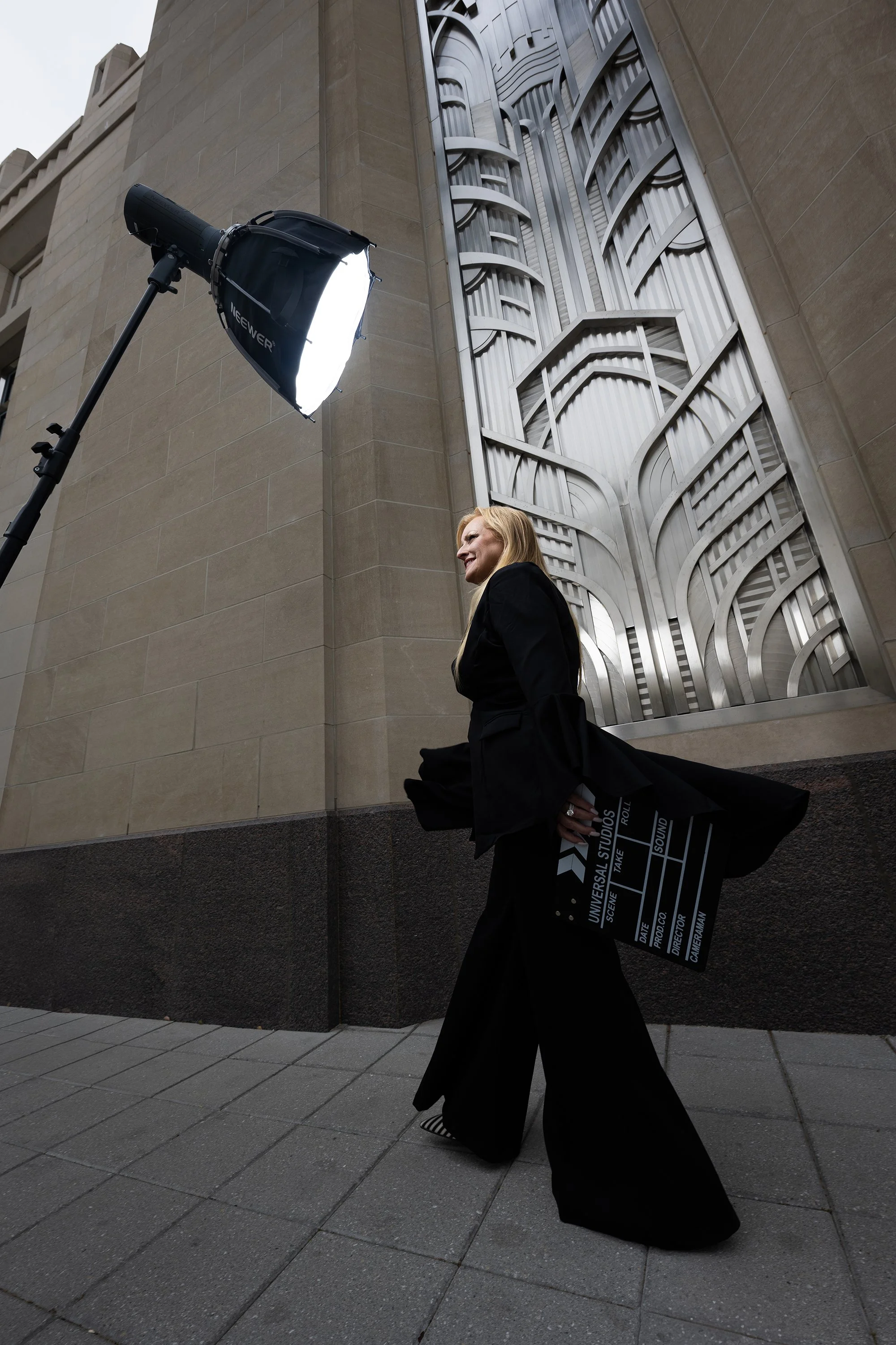 Businesswoman during a dramatic studio photoshoot built for ongoing marketing content.