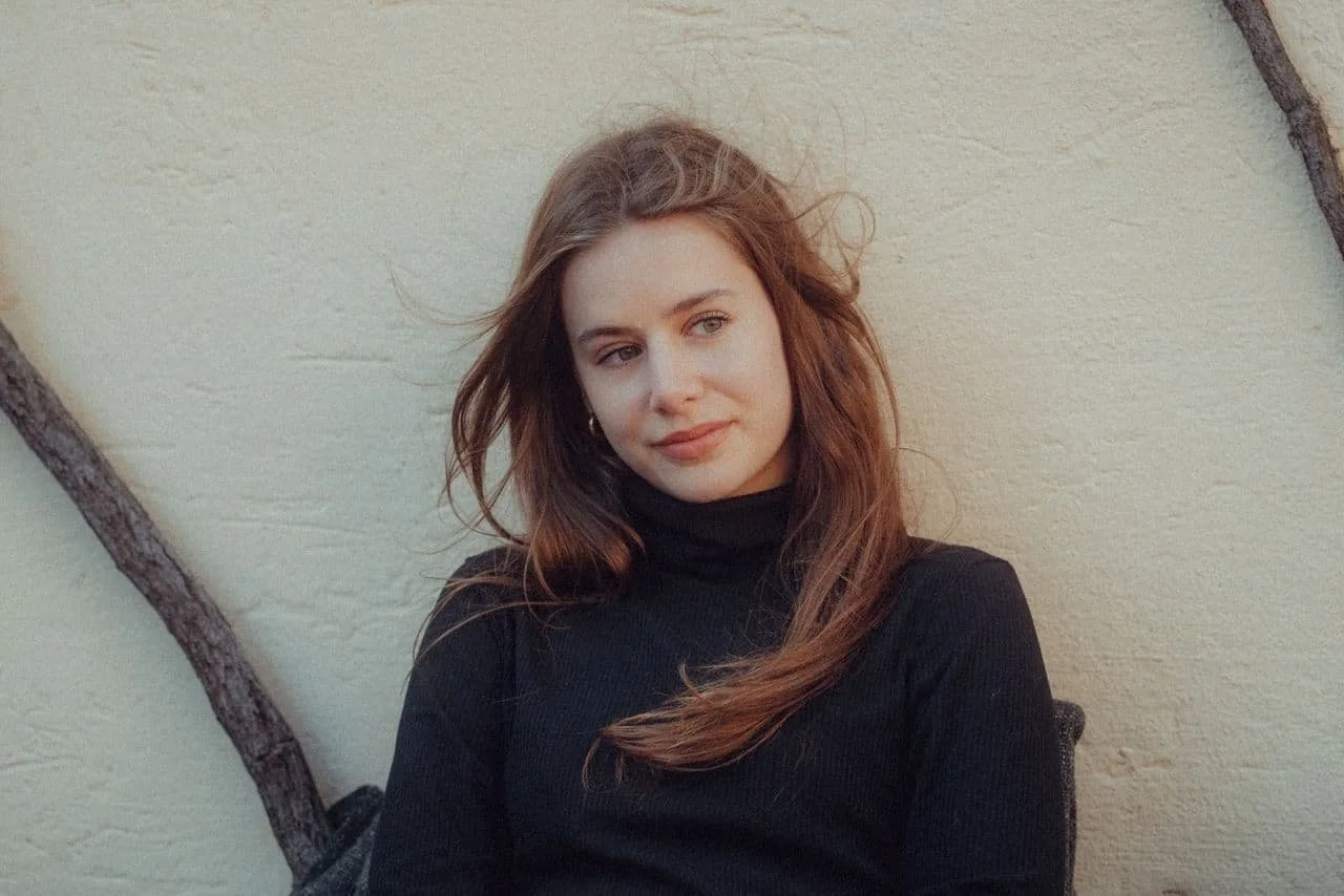 portrait-of-woman-in-black-sweater