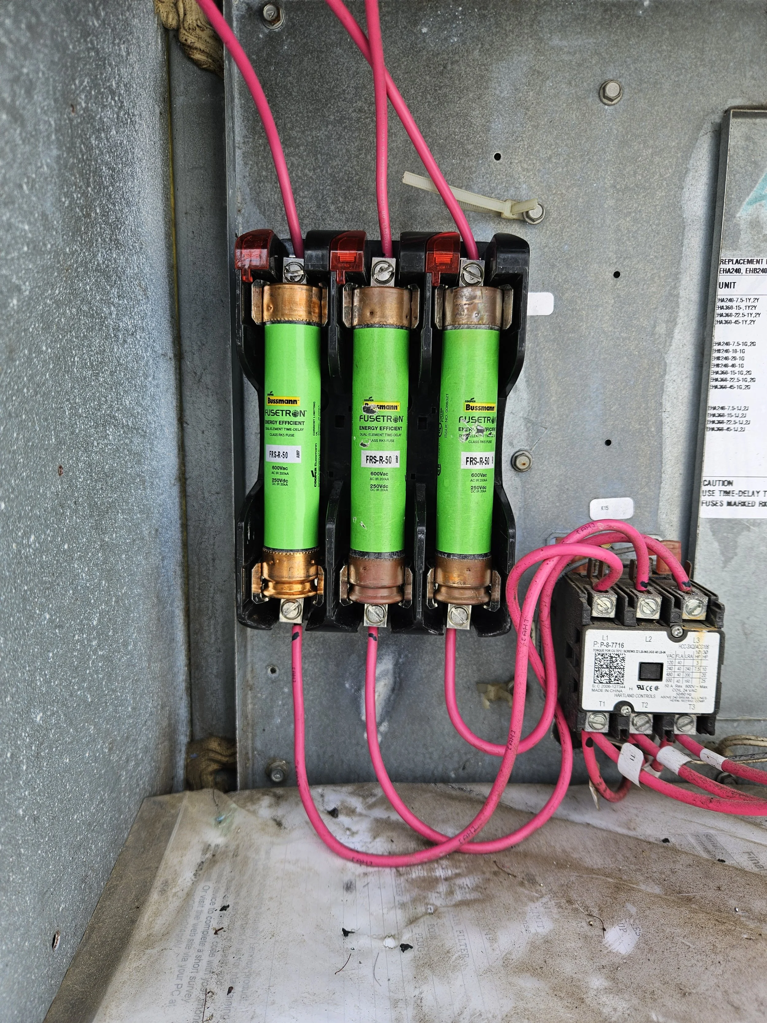 New fuse box installed with wires neatly place back into place. 