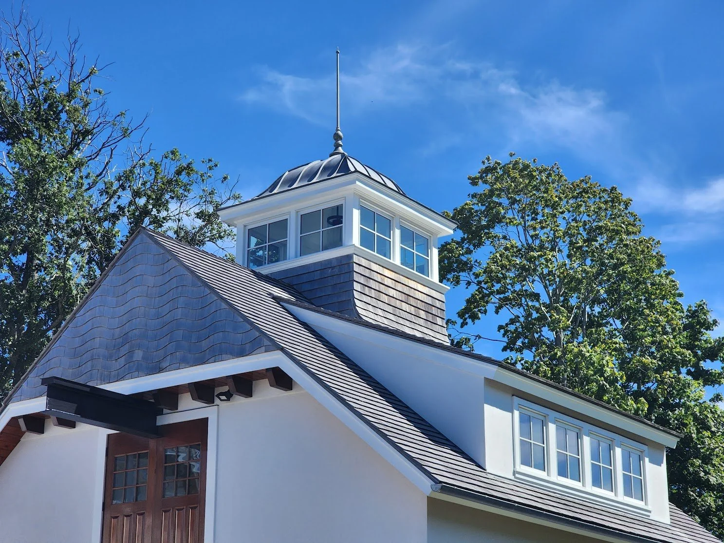 Wood siding, wood roofing, copper finial by Slate & Copper Services, Portsmouth, RI.