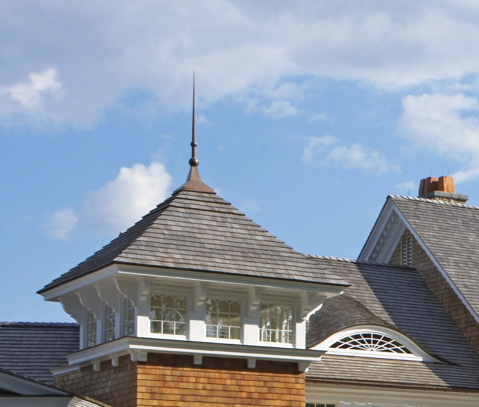 Custom copper finial and slate roof by Slate and Copper Services in Portsmouth, Rhode Island and Easton, Connecticut, serving Fairfield County, Providence, coastal RI, and South Coast, MA.