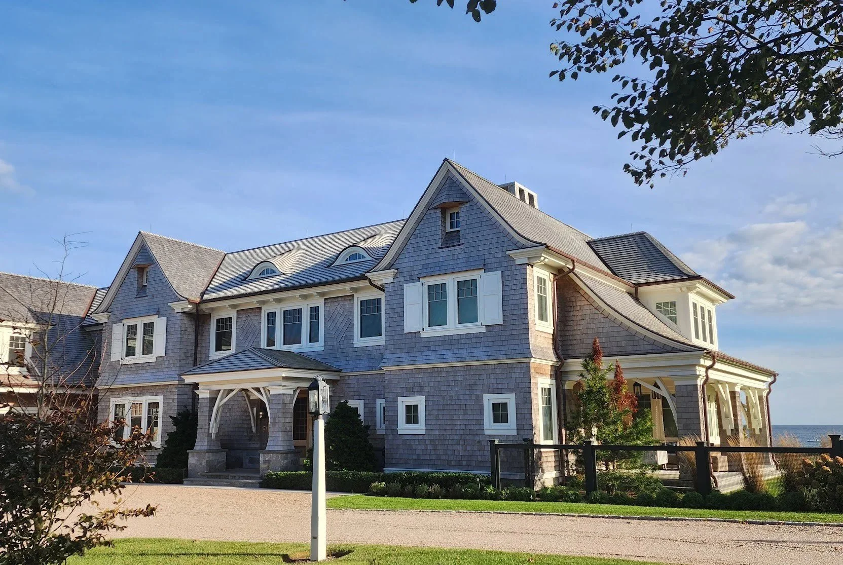 Wood roofing and siding on coastal home in Rhode Island by Slate & Copper Services, Portsmouth, RI, and Easton, Connecticut
