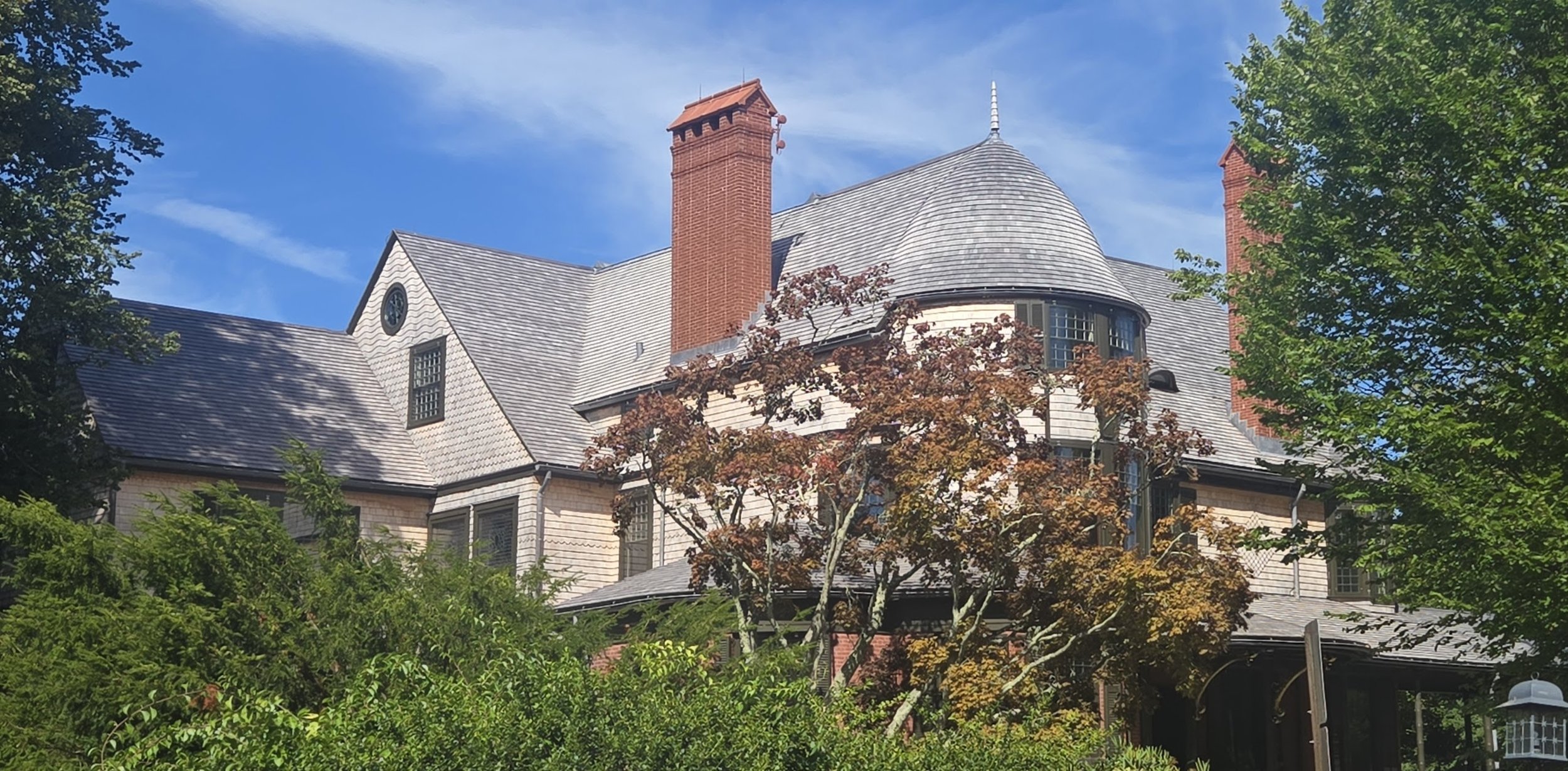 Historic preservation/restoration at the Isaac Bell house, featuring wood siding and wood roofing in Newport, RI, by Slate and Copper Services