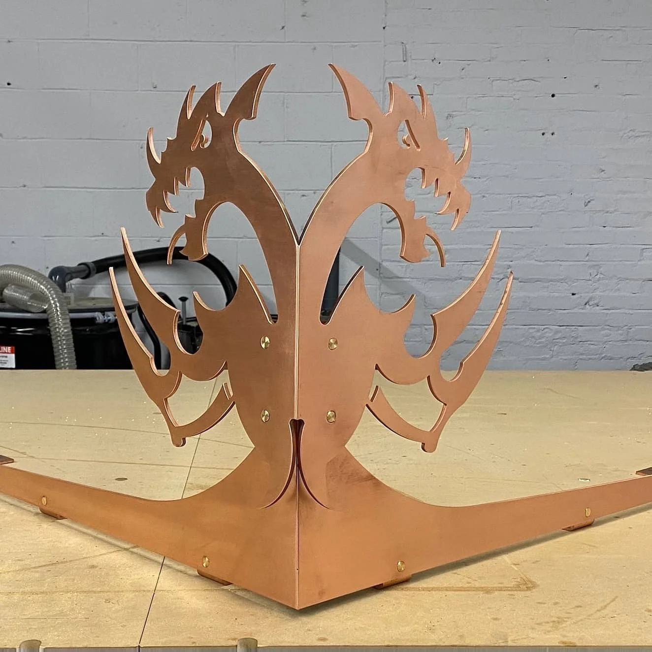 Copper dragon finial by Slate and Copper Services in Portsmouth, Rhode Island and Easton, Connecticut, serving Fairfield County, Providence, coastal RI, and South Coast, MA.