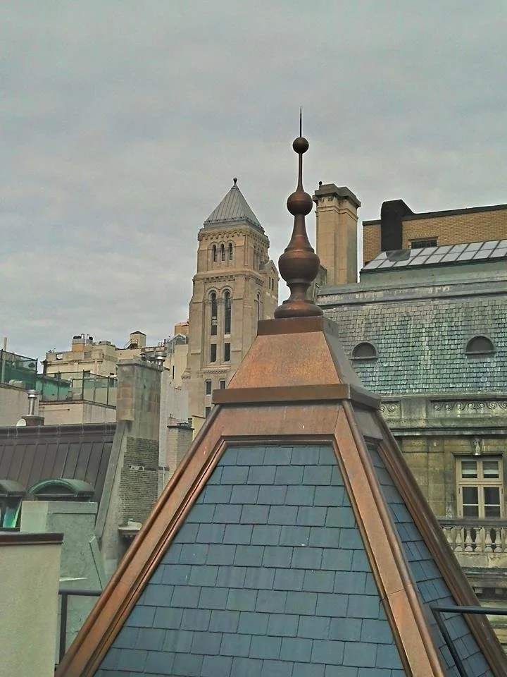 Custom copper finial and slate roof by Slate and Copper Services in Portsmouth, Rhode Island and Easton, Connecticut, serving Fairfield County, Providence, coastal RI, and South Coast, MA.