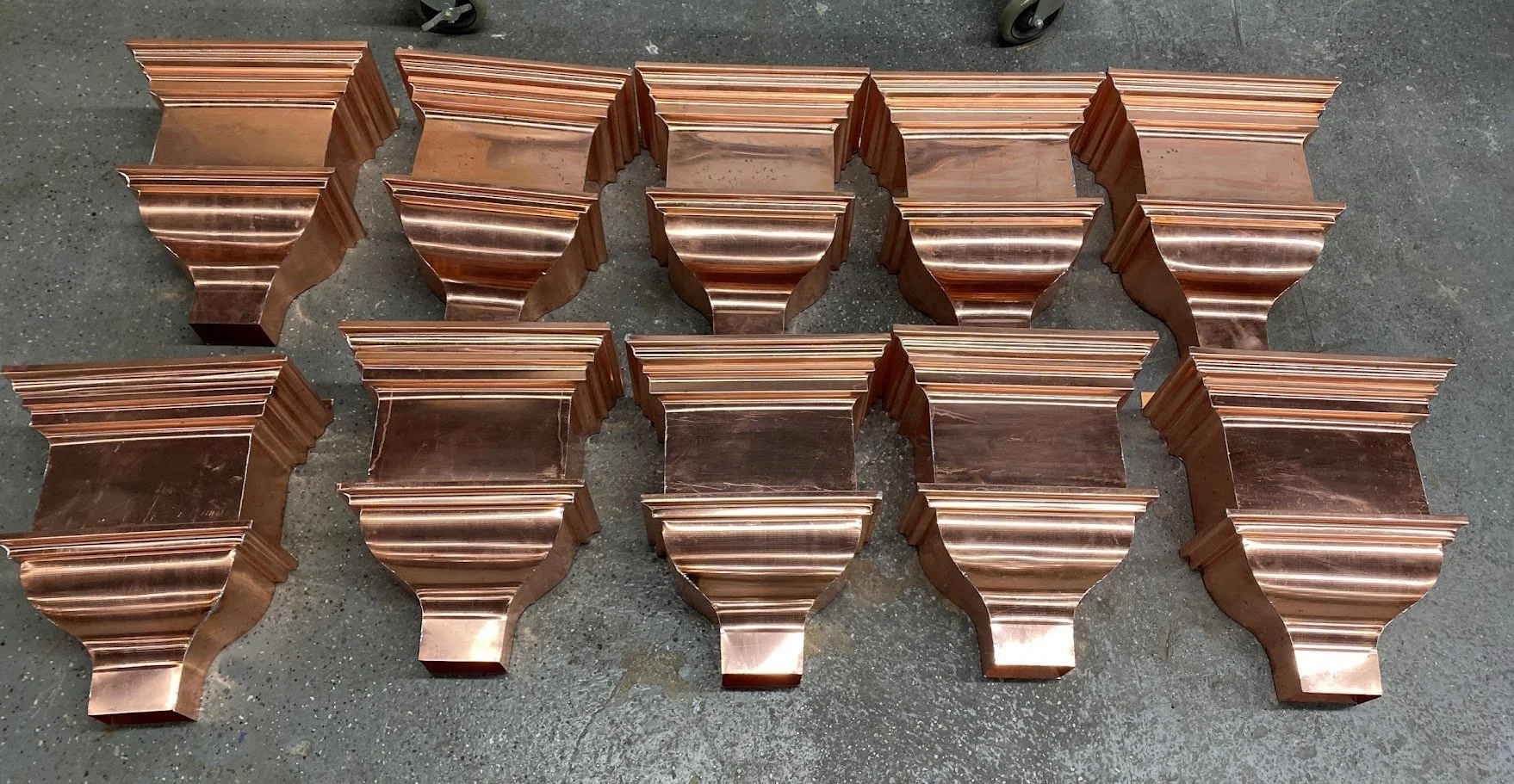 Copper guttering by Slate and Copper Services in Portsmouth, Rhode Island and Easton, Connecticut, serving Fairfield County, Providence, coastal RI, and South Coast, MA. These are leader heads.