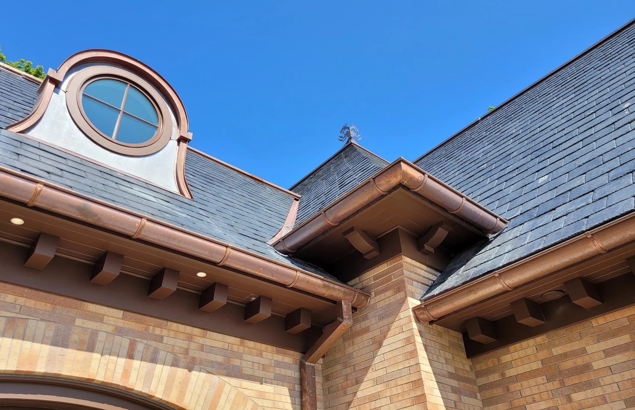 Slate roofing, wood siding, and copper guttering by Slate and Copper Services in Portsmouth, Rhode Island and Easton, Connecticut, serving Fairfield County, Providence, coastal RI, and South Coast, MA.