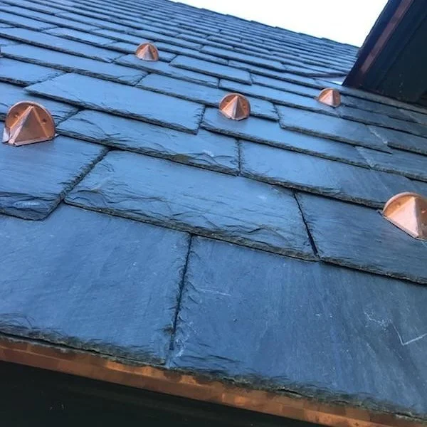 Slate roofing and copper snow guards on home by Slate & Copper Services, Portsmouth, RI, and Easton, Connecticut
