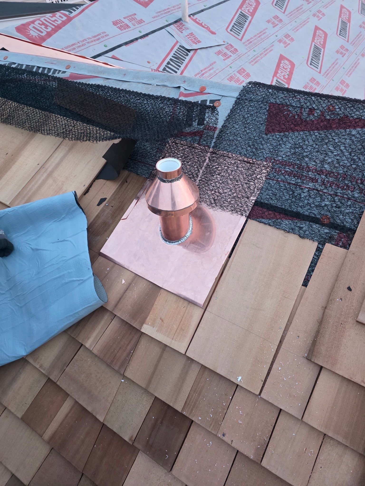 Custom copper vent cap and wood roofing by Slate and Copper Services in Portsmouth, Rhode Island and Easton, Connecticut, serving Fairfield County, Providence, coastal RI, and South Coast, MA.