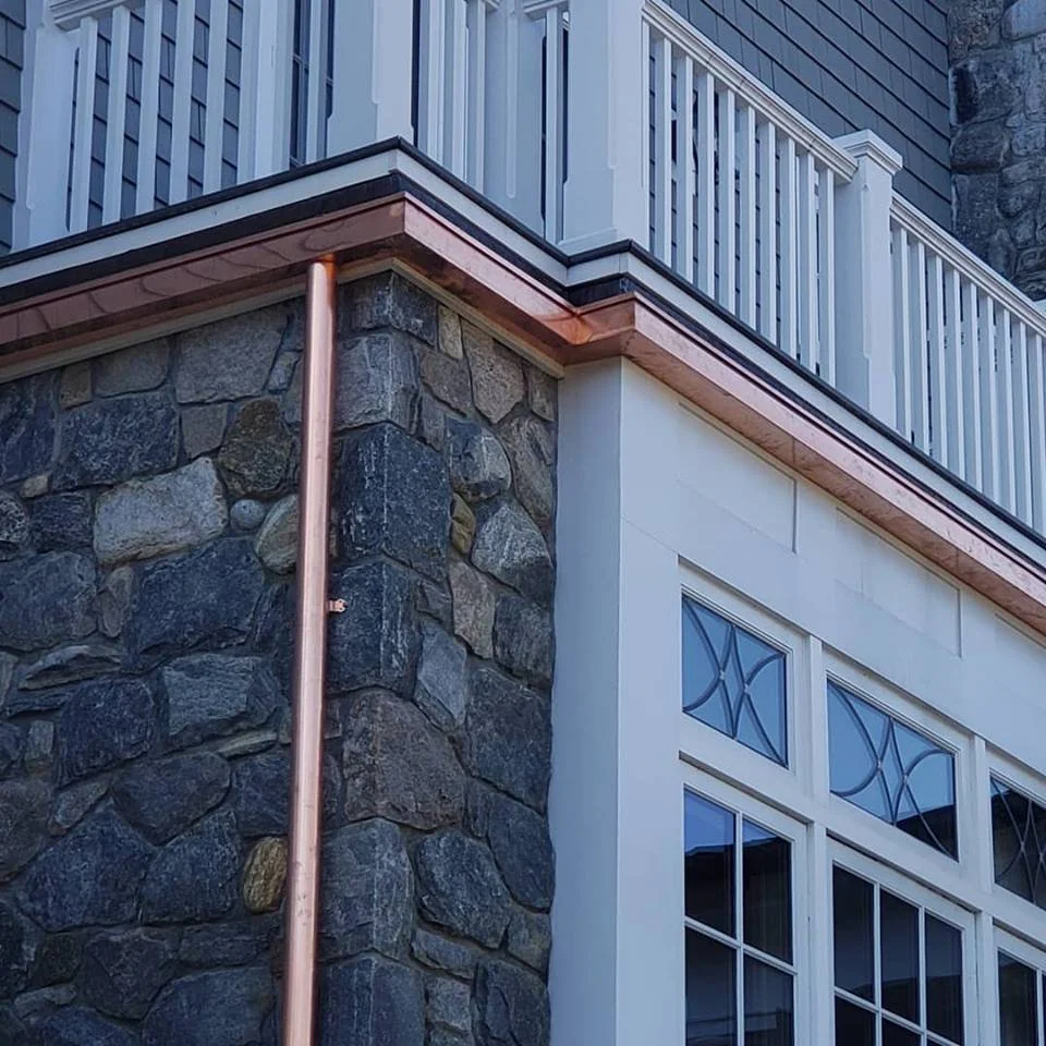 Copper guttering by Slate and Copper Services in Portsmouth, Rhode Island and Easton, Connecticut, serving Fairfield County, Providence, coastal RI, and South Coast, MA.