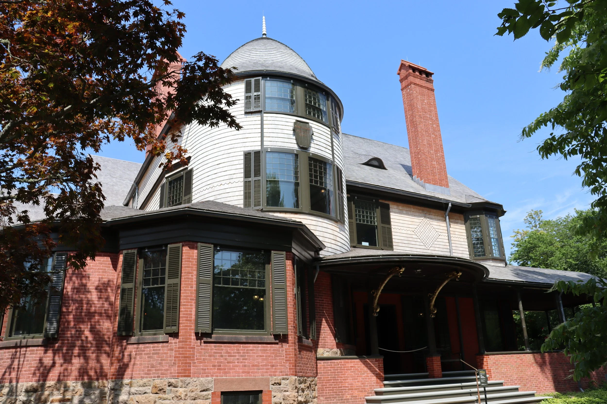 Historic preservation/restoration at the Isaac Bell house, featuring wood siding and wood roofing in Newport, RI, by Slate and Copper Services