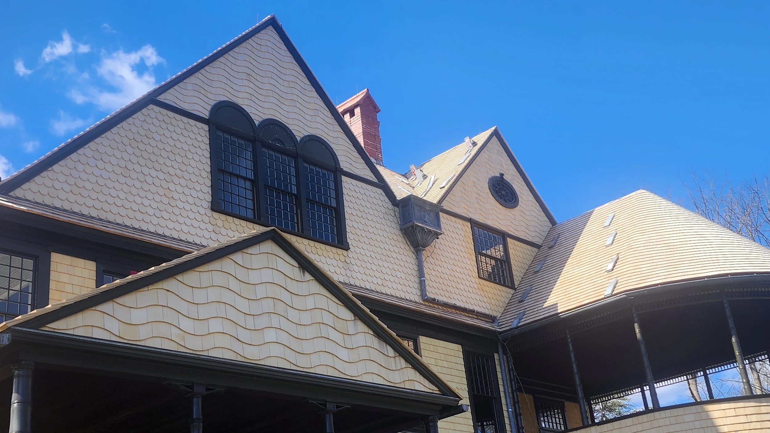 Historic preservation/restoration at the Isaac Bell house, featuring wood siding and wood roofing in Newport, RI, by Slate and Copper Services