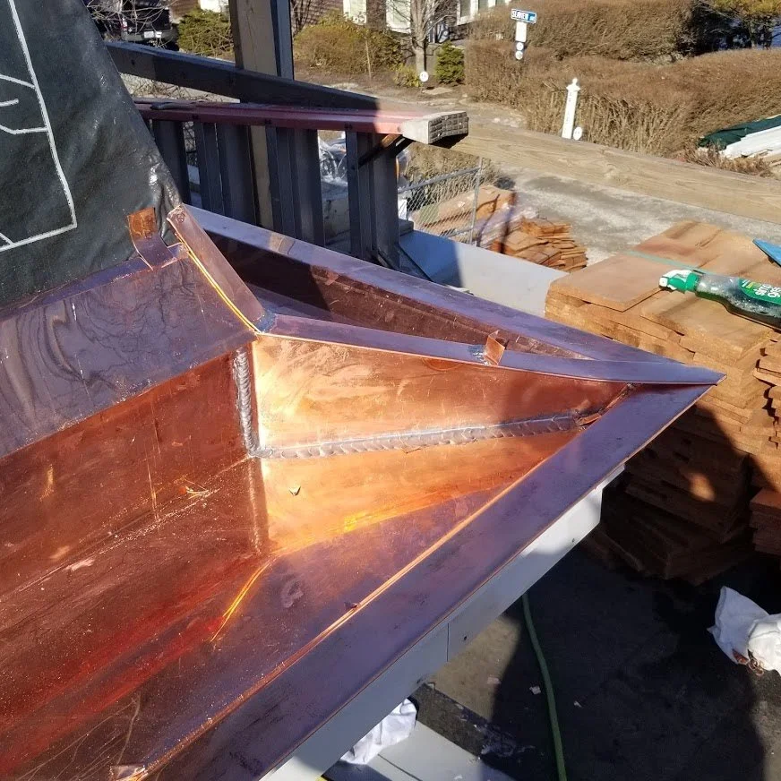 Copper guttering by Slate and Copper Services in Portsmouth, Rhode Island and Easton, Connecticut, serving Fairfield County, Providence, coastal RI, and South Coast, MA.