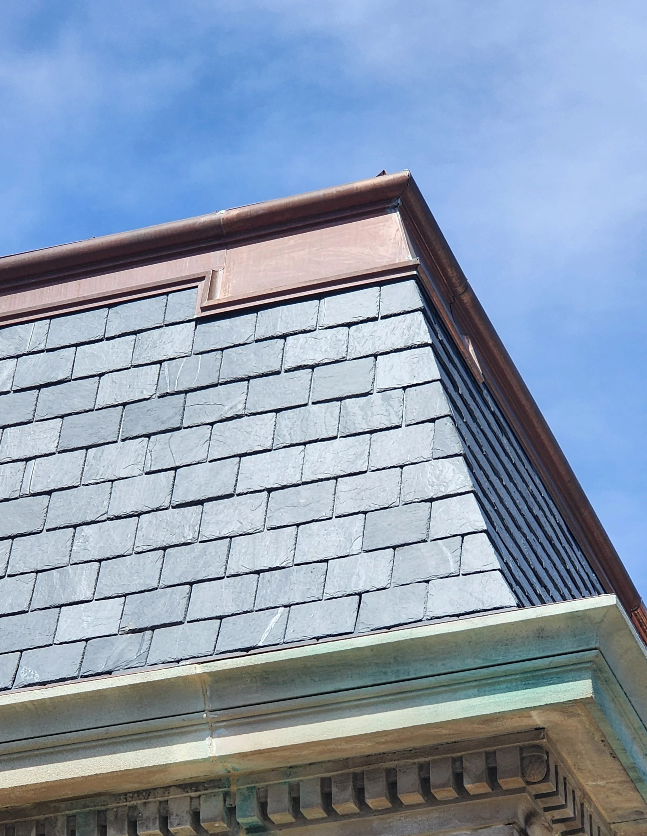 Copper cornice and slate roof by Slate and Copper Services in Portsmouth, Rhode Island and Easton, Connecticut, serving Fairfield County, Providence, coastal RI, and South Coast, MA.