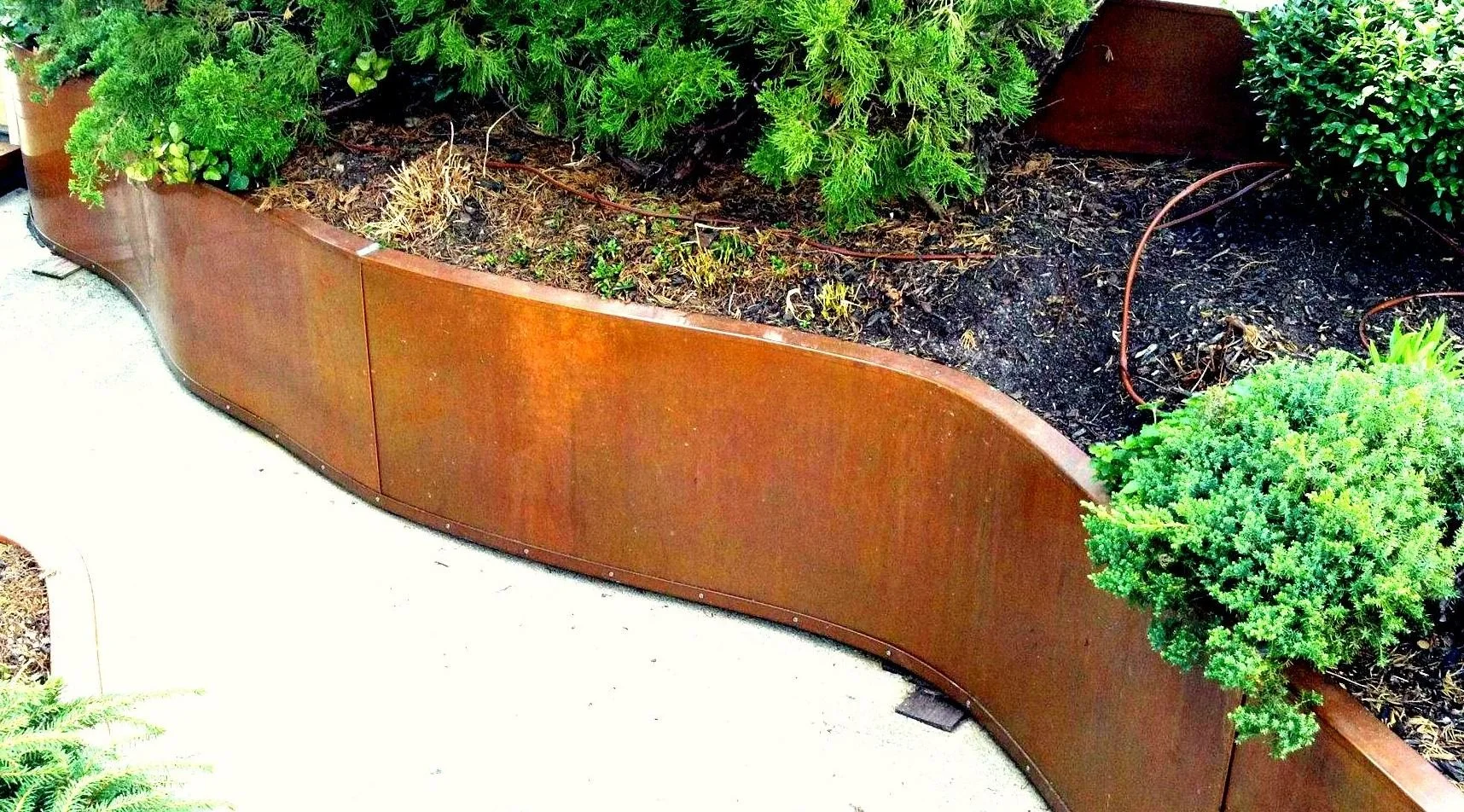 Copper garden wall by Slate and Copper Services in Portsmouth, Rhode Island and Easton, Connecticut, serving Fairfield County, Providence, coastal RI, and South Coast, MA.