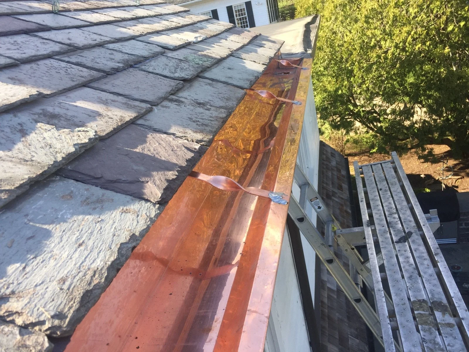 Copper guttering by Slate and Copper Services in Portsmouth, Rhode Island and Easton, Connecticut, serving Fairfield County, Providence, coastal RI, and South Coast, MA.