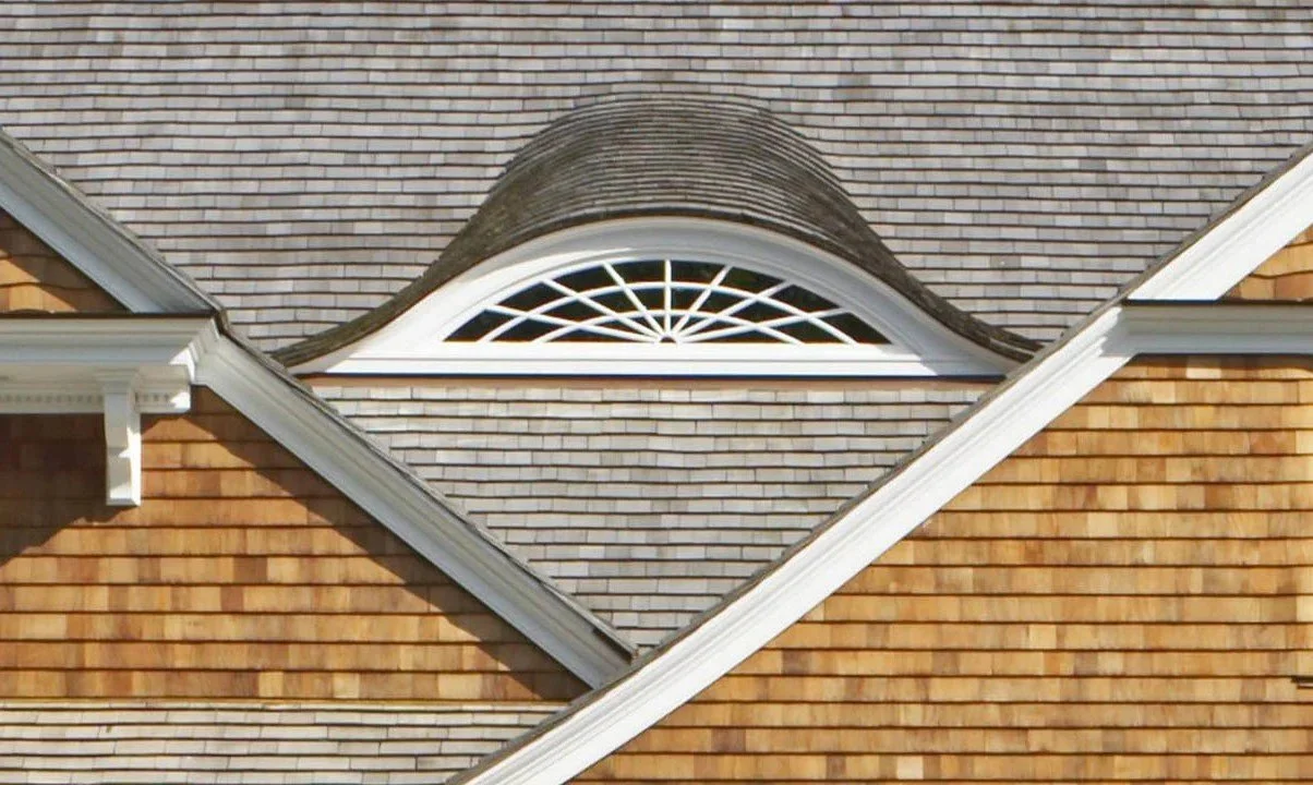 Wood roofing and siding restoration, and bent cedar eye on historic home in Newport, Rhode Island by Slate & Copper Services, Portsmouth, RI, and Easton, Connecticut