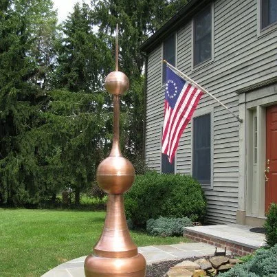 Custom copper finial by Slate and Copper Services in Portsmouth, Rhode Island and Easton, Connecticut, serving Fairfield County, Providence, coastal RI, and South Coast, MA.

