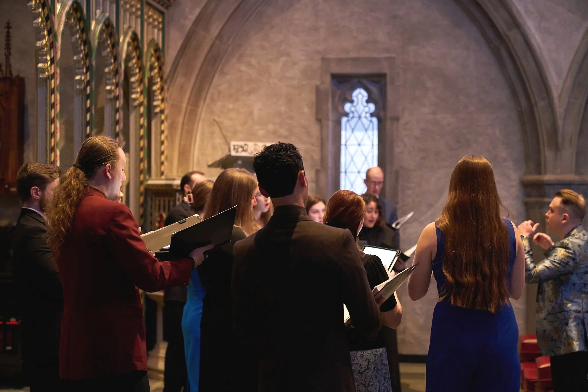 Sphere Born choir and conductor Simon Thomas Jacobs performing during a concert at Trinity Episcopal Church, Indianapolis.